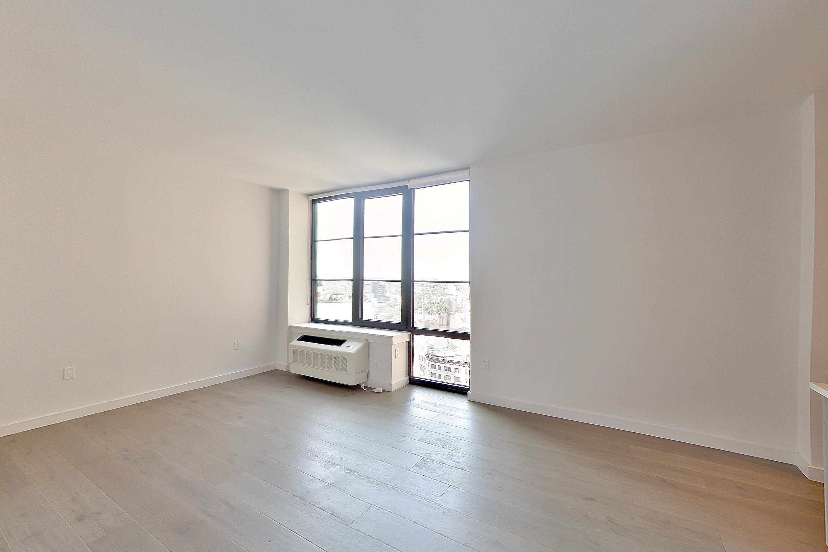 Living room closet with air conditioning, light wood-finish flooring, and wood-finish flooring, Apartment 1601 at 1 Flatbush