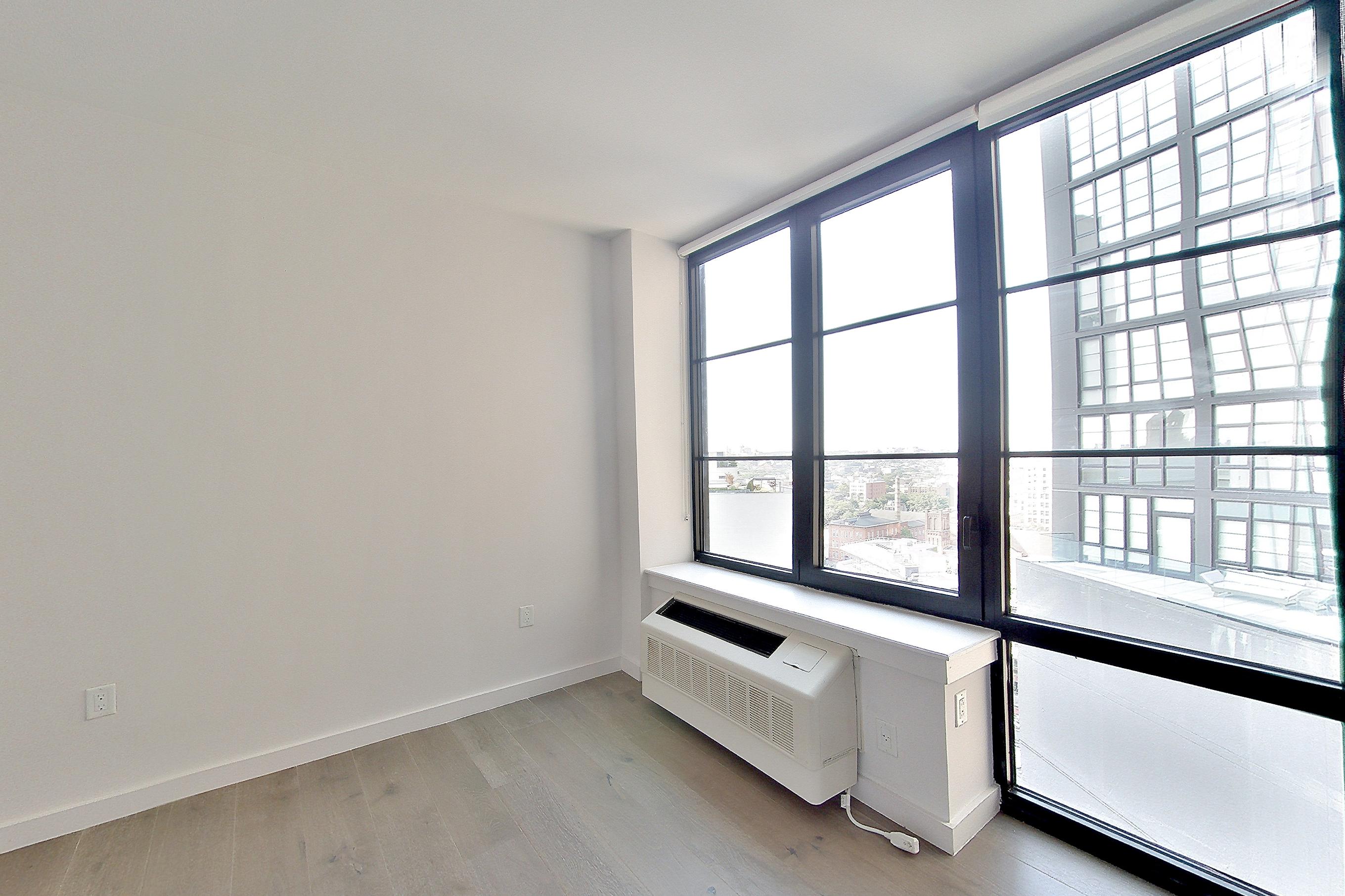 Living room with air conditioning and light wood-finish flooring, Apartment 1601 at 1 Flatbush