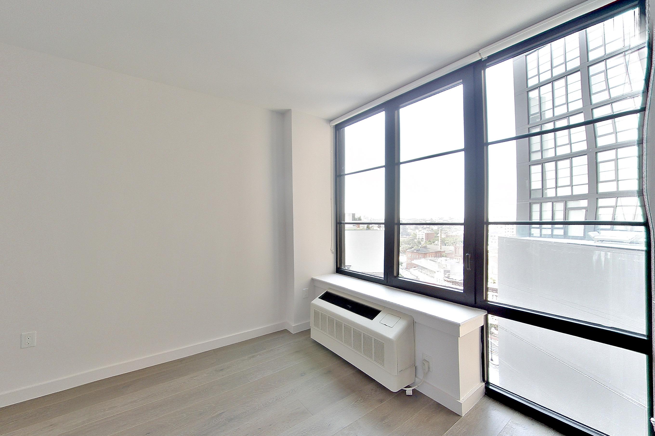 Living room with air conditioning and light wood-finish flooring, Apartment 1501 at 1 Flatbush