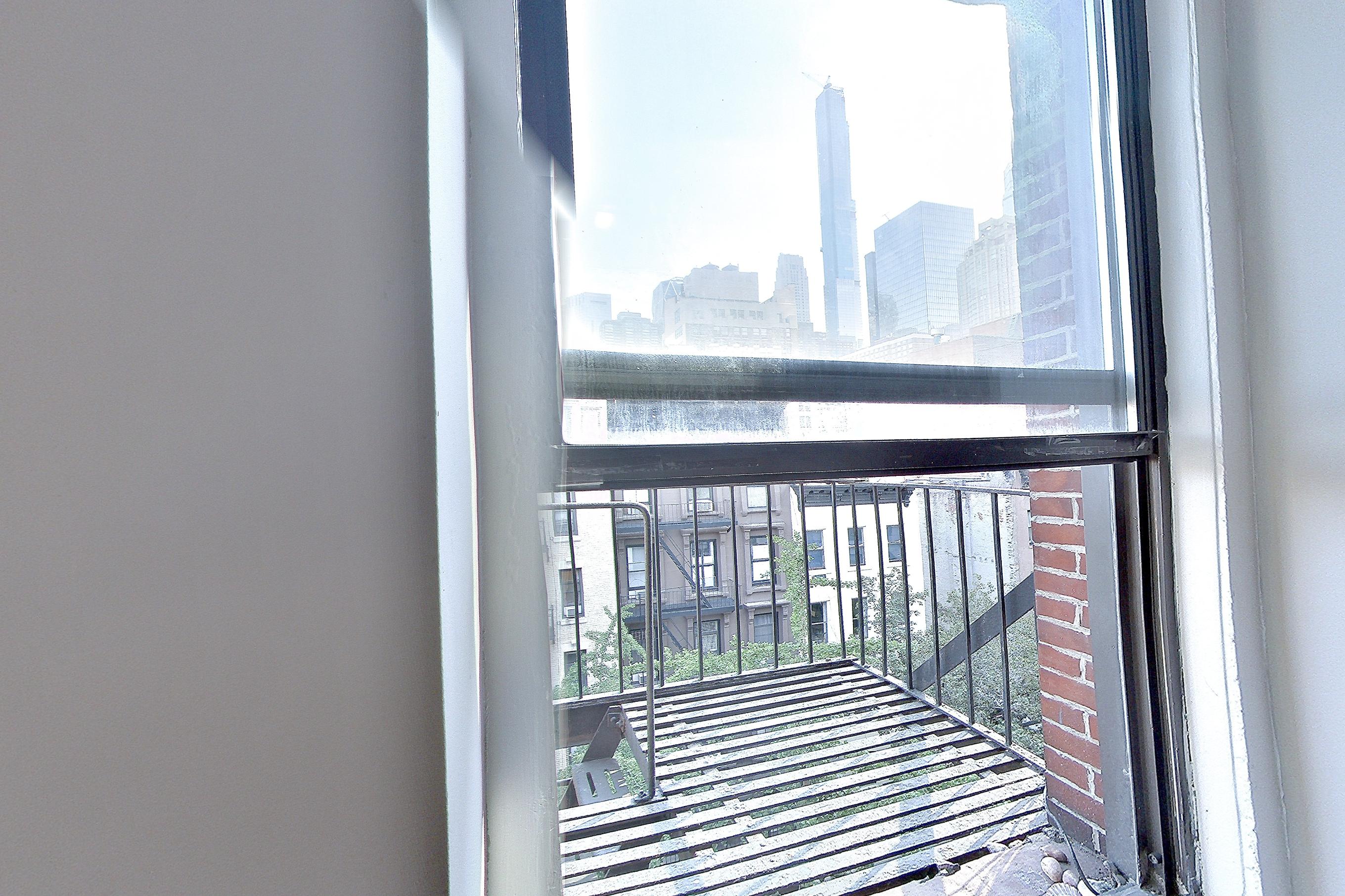 Living space 2 with city view, Apartment EA at Centennial Properties