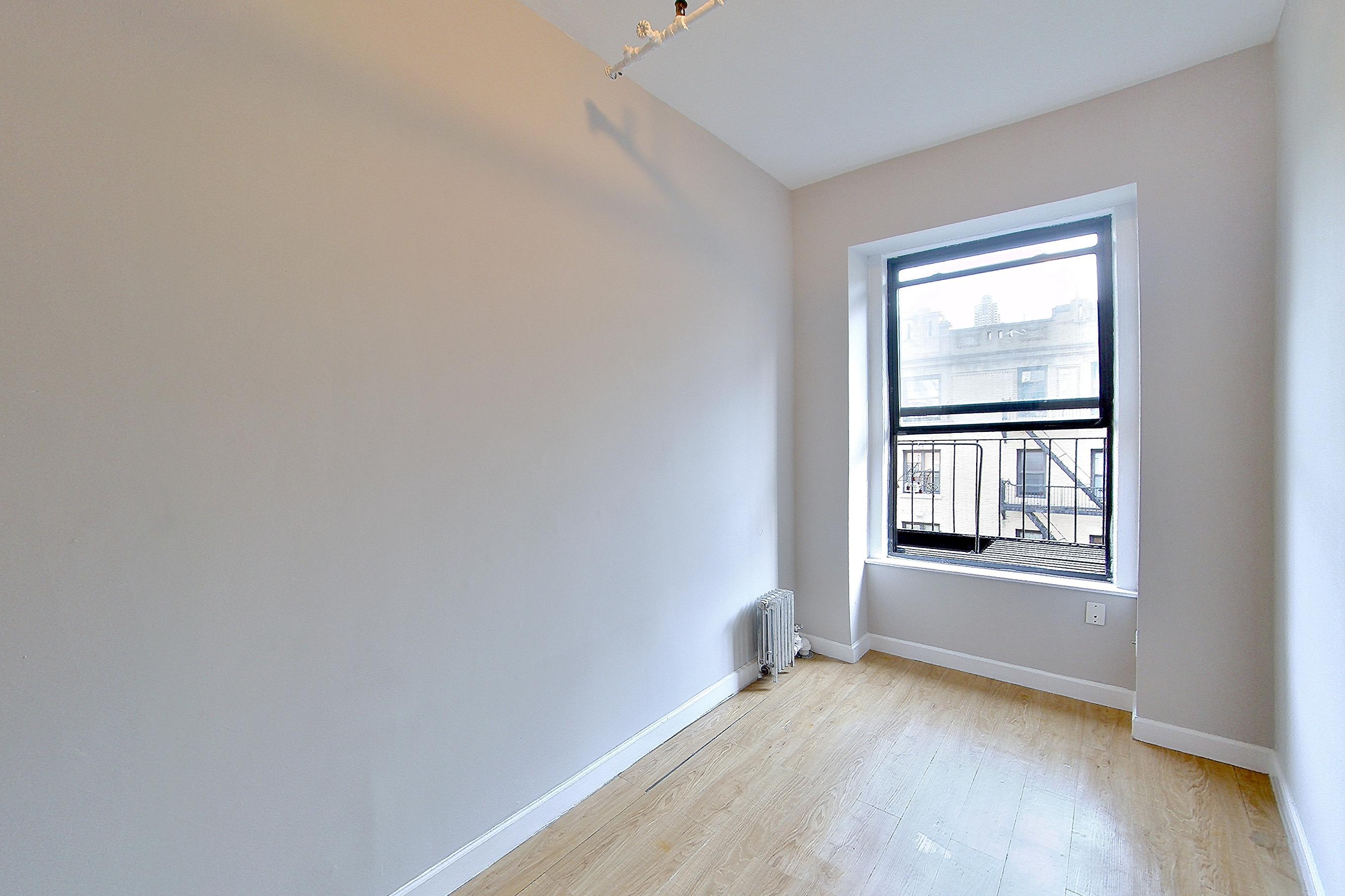 Living space with radiator heat, Apartment EA at Centennial Properties