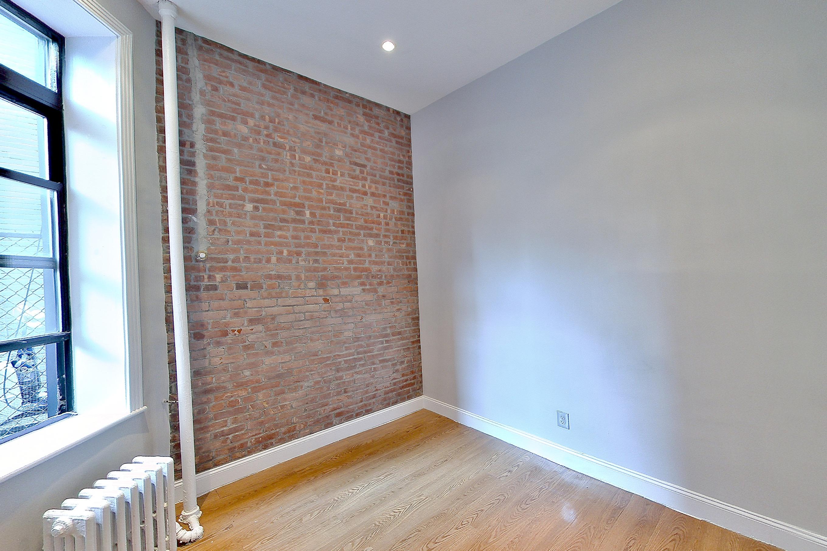 Living space 2 with radiator heat, Apartment AE at Centennial Properties