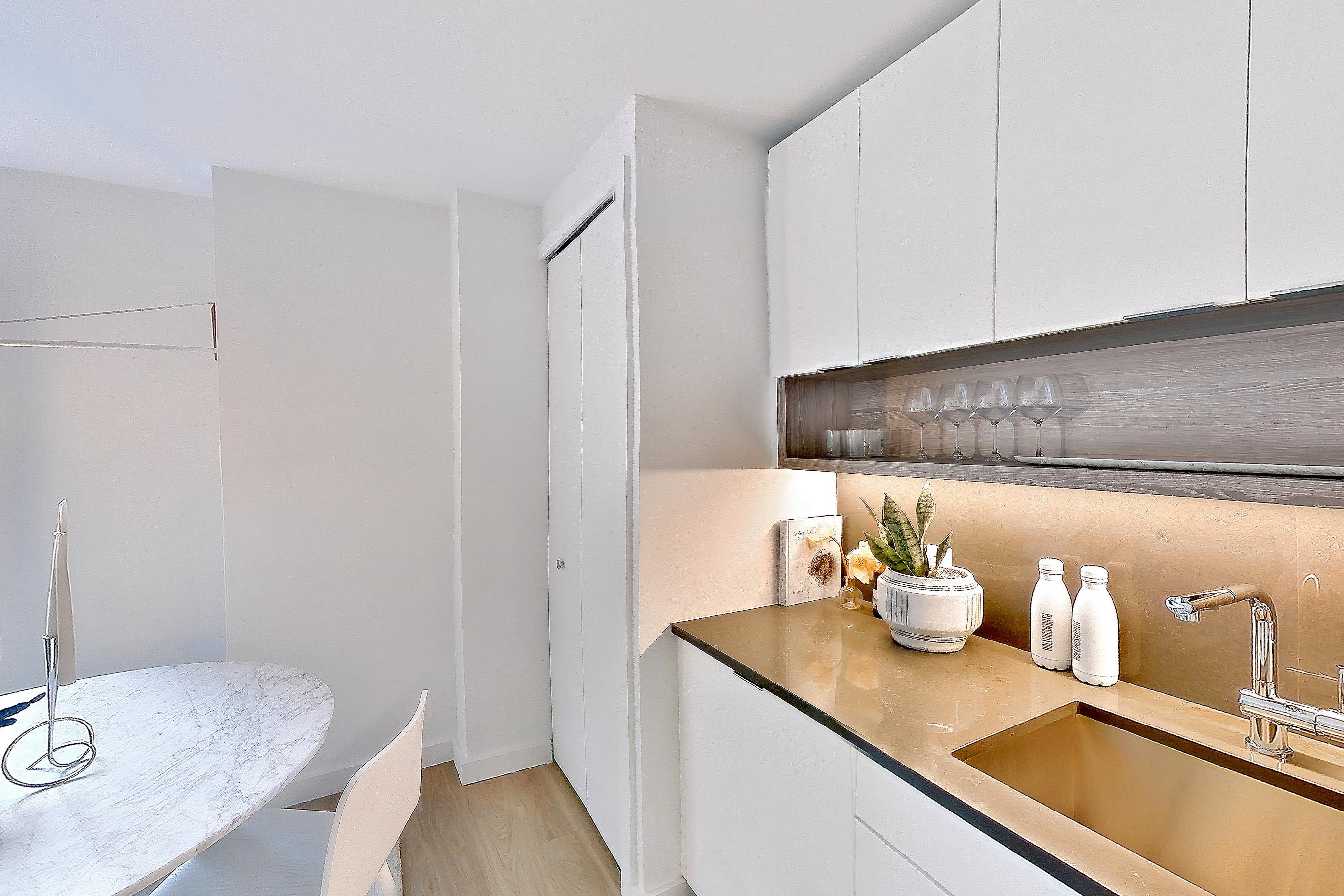 Kitchen with gas range, light wood-finish flooring, oven/range, and stainless steel appliances, Apartment 12 line studio at Hollingsworth