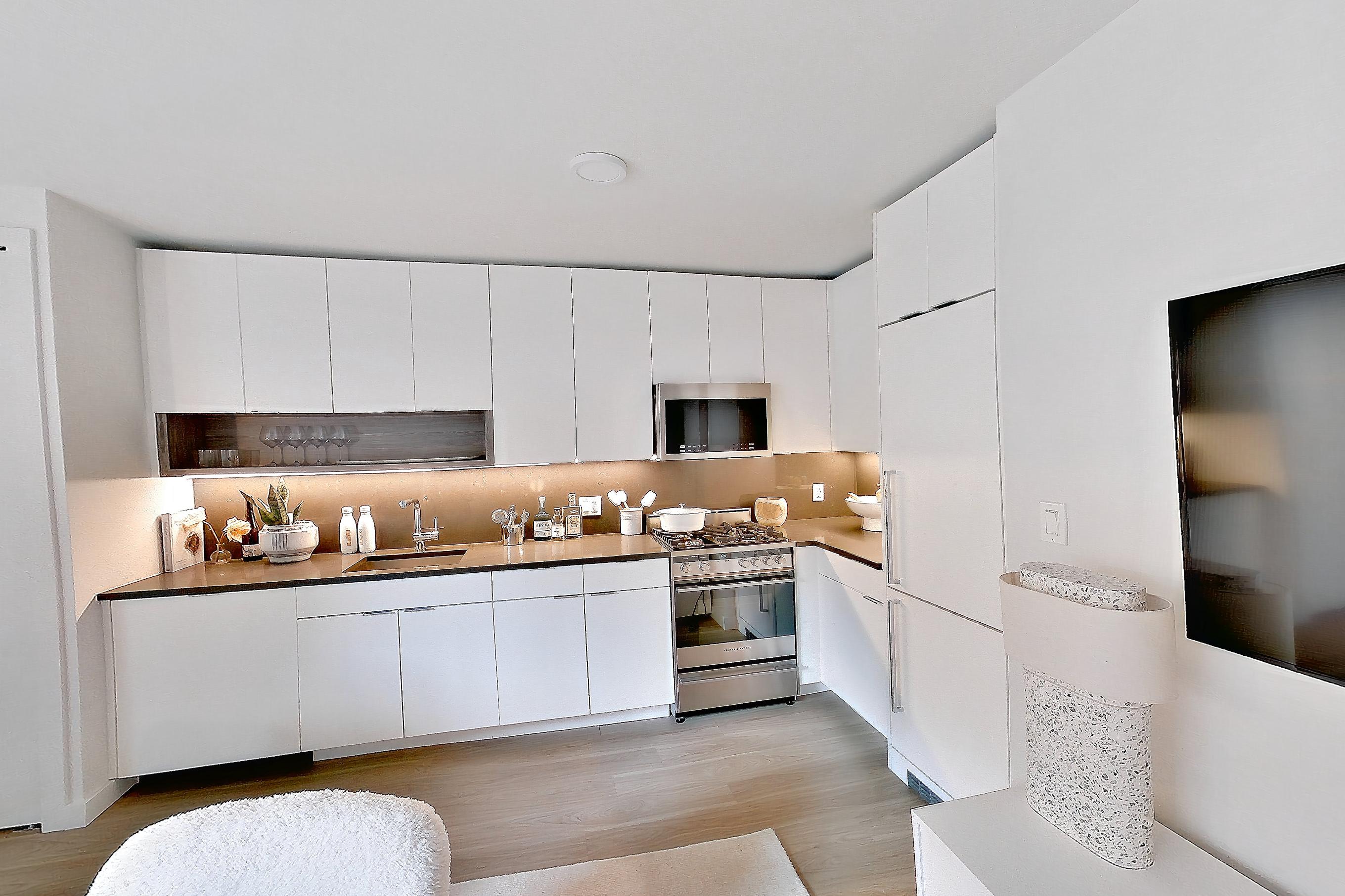 Living space with gas range, light wood-finish flooring, oven/range, and stainless steel appliances, Apartment 12 line studio at Hollingsworth