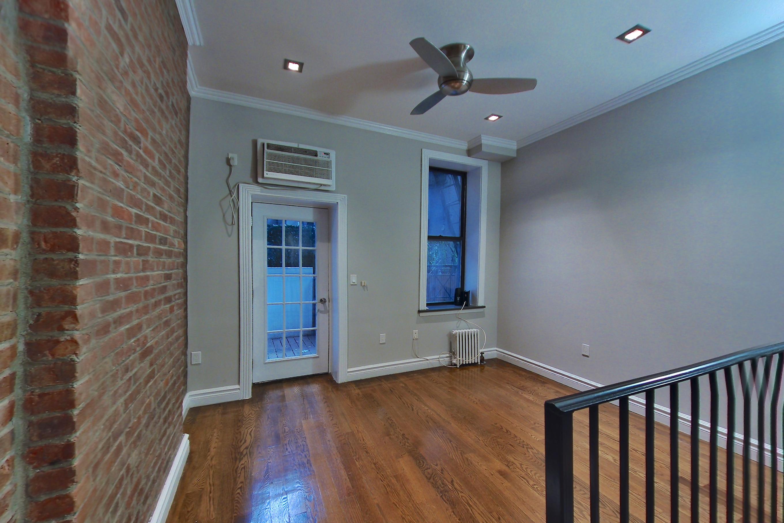 Living space with air conditioning and radiator heat, Apartment 3 at Centennial Properties
