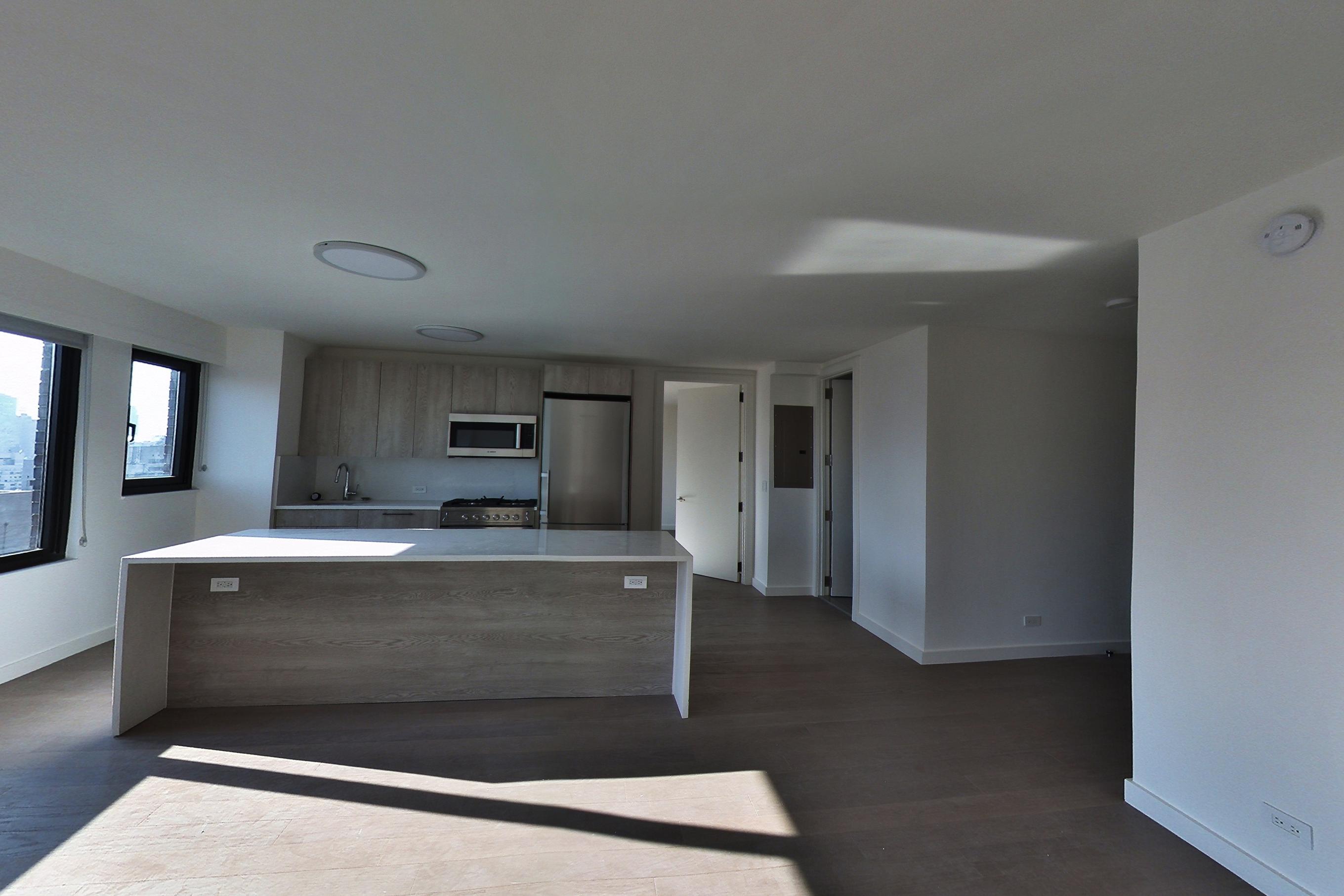 Living room with dark wood-finish flooring, Apartment 27A at 220 East 72nd