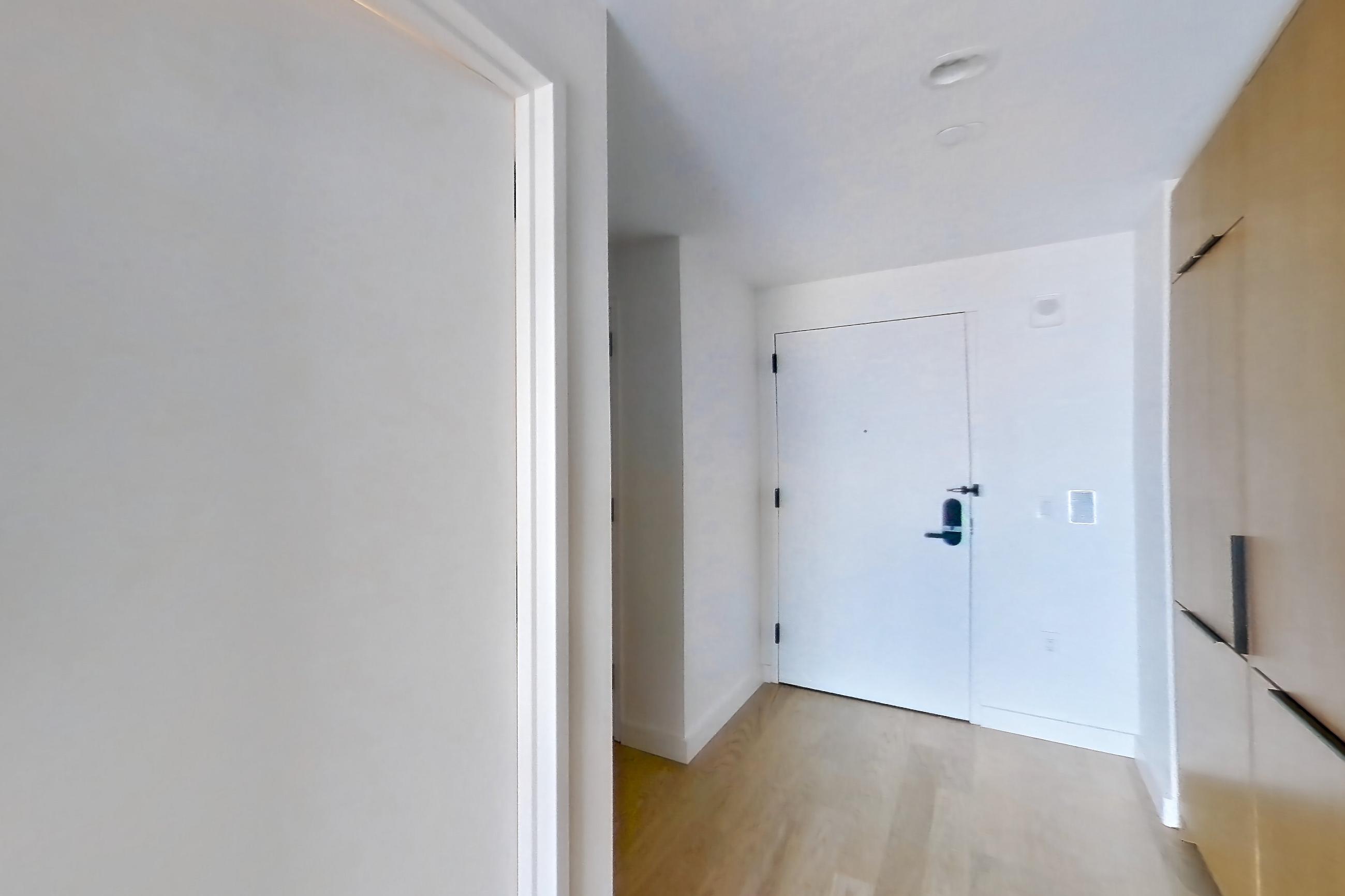 Kitchen with gas range, light wood-finish flooring, oven/range, and stainless steel appliances, Apartment 0-05E at The Bellslip