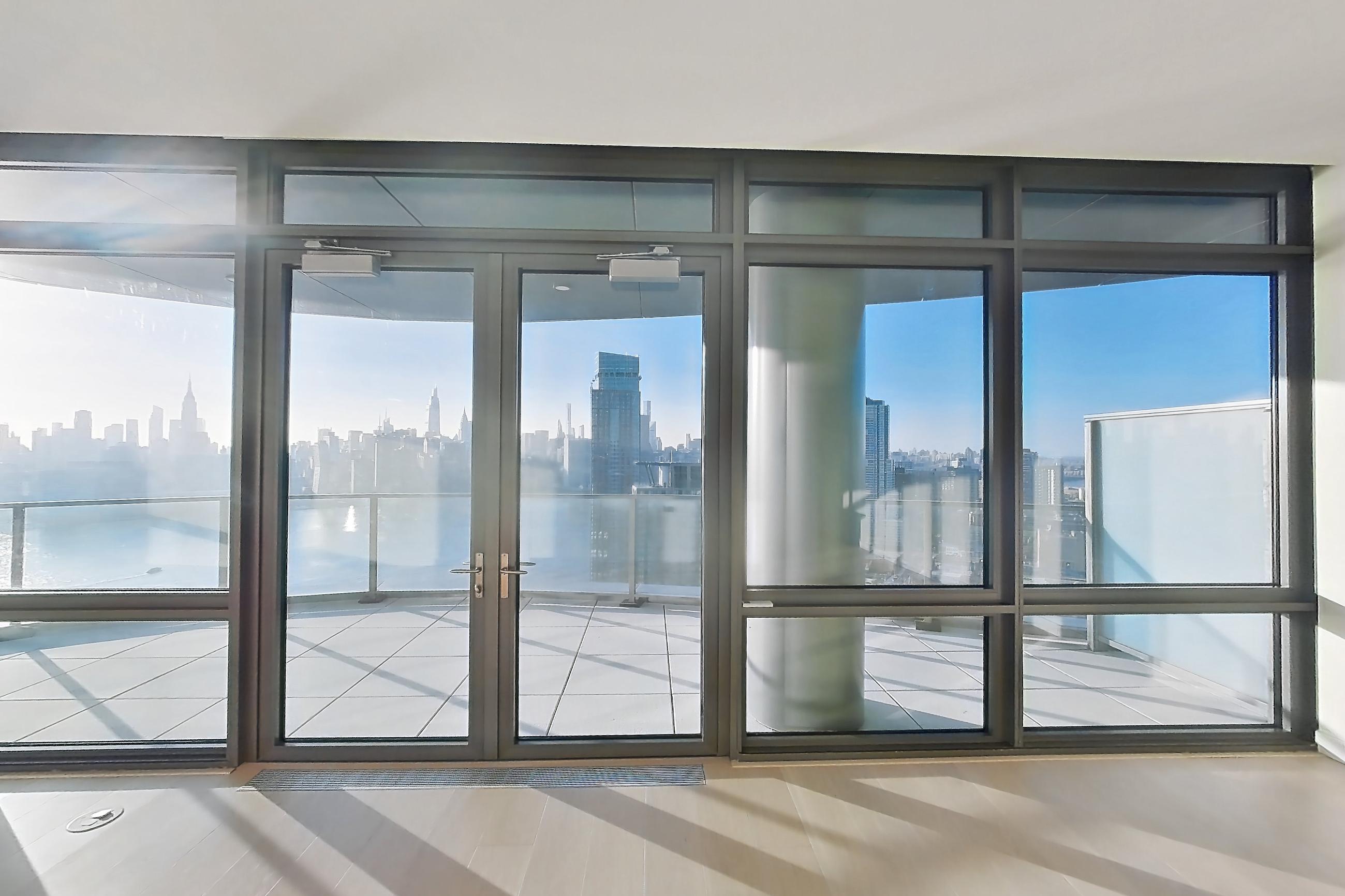 Living room with city view, Apartment PH2-C at The Bellslip