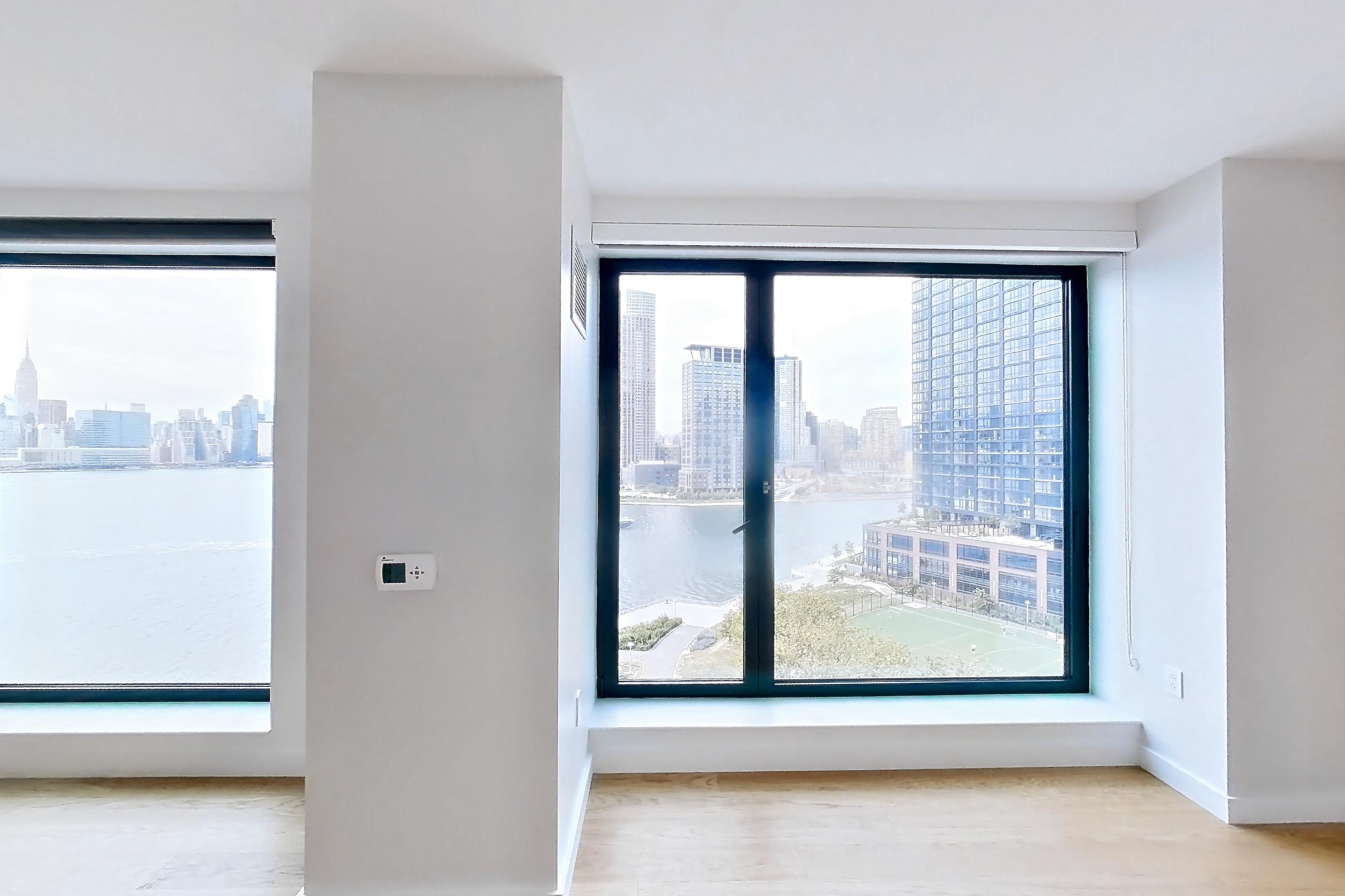 Living space with city view, Apartment 2-1024 at Eagle + West