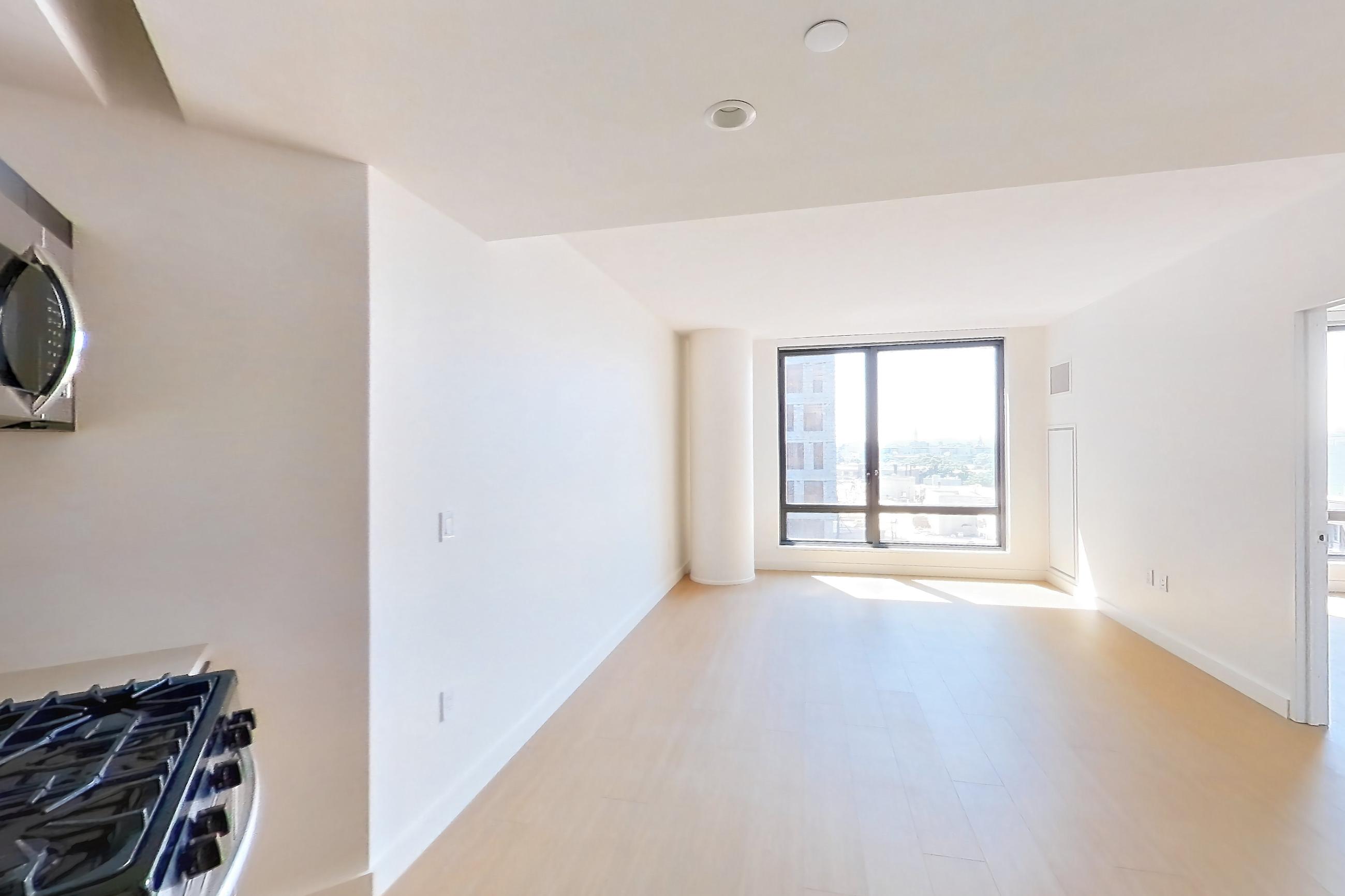 Kitchen with gas range, light wood-finish flooring, oven/range, and stainless steel appliances, Apartment 08P at The Bellslip
