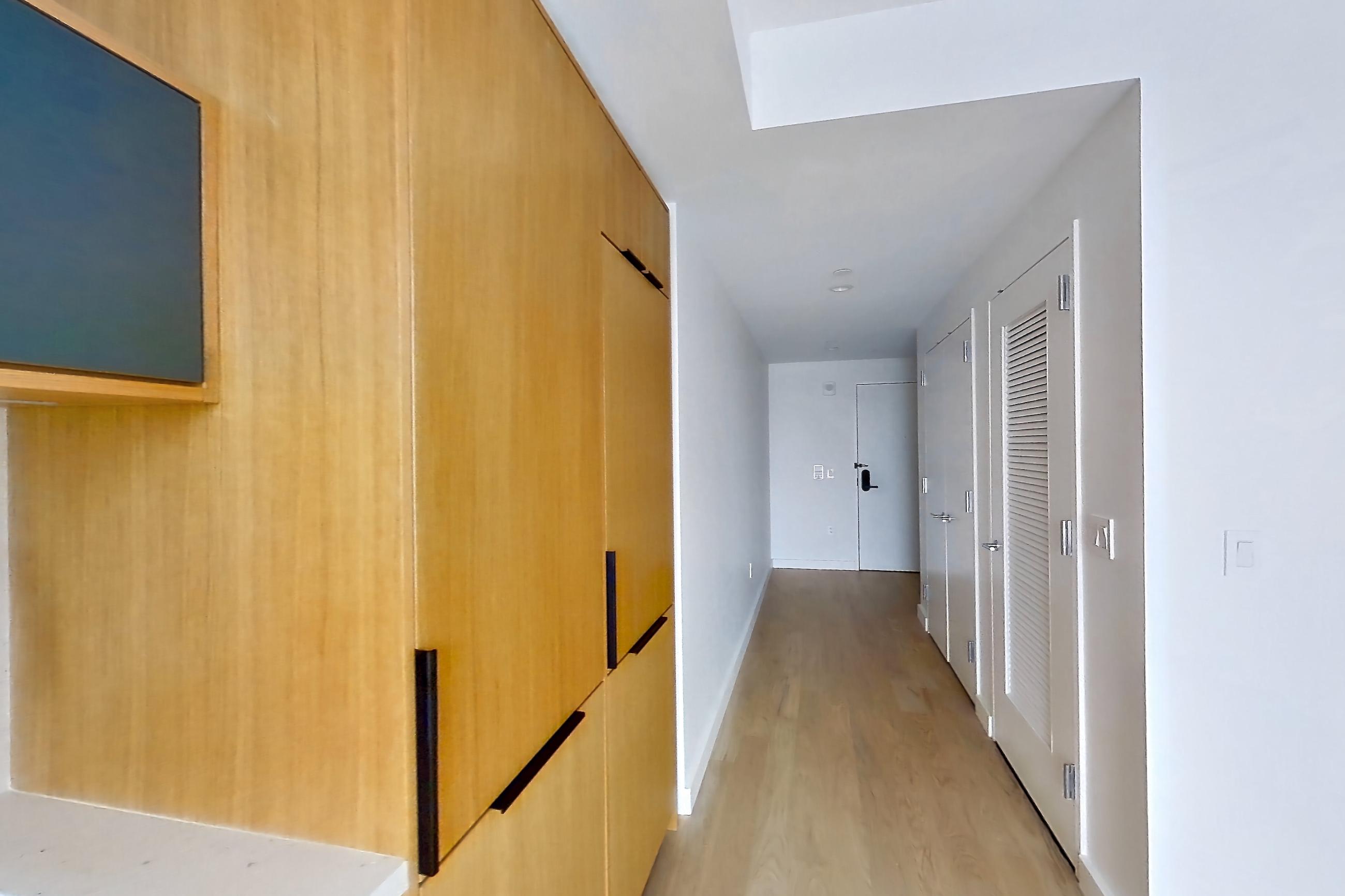 Kitchen with gas range, light stone countertops, and light wood-finish flooring, Apartment 0-08H at The Bellslip