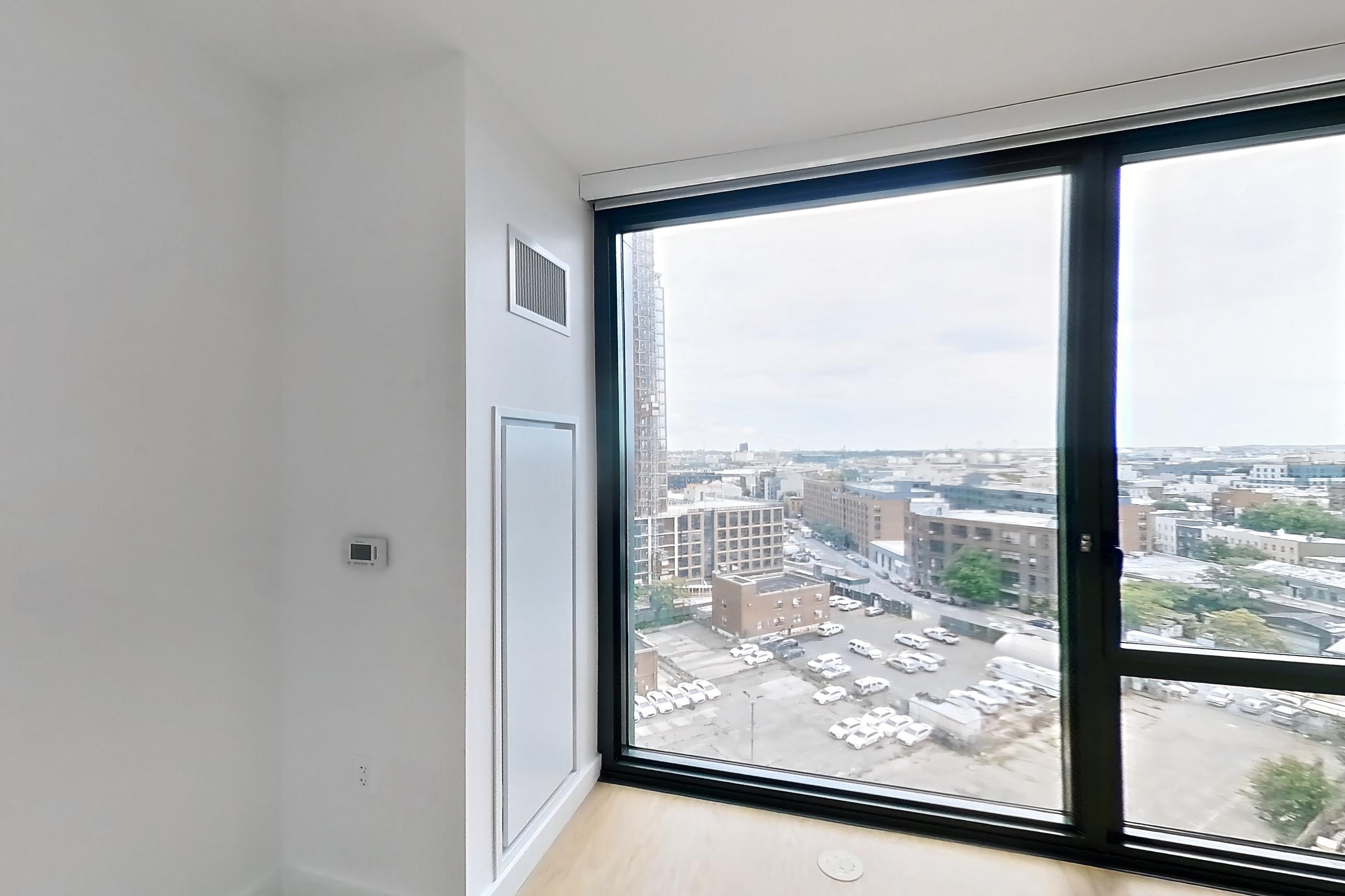 Living space with city view, Apartment 0-11D at The Bellslip