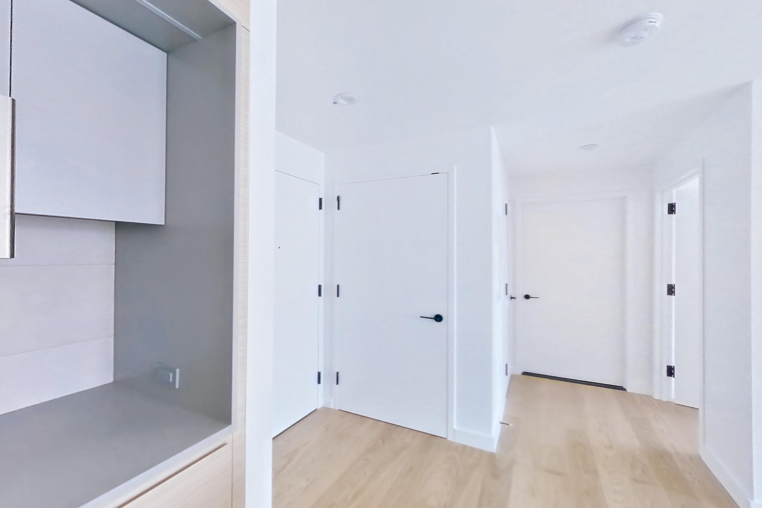 Kitchen with light wood-finish flooring, Apartment 1026 at Eagle + West