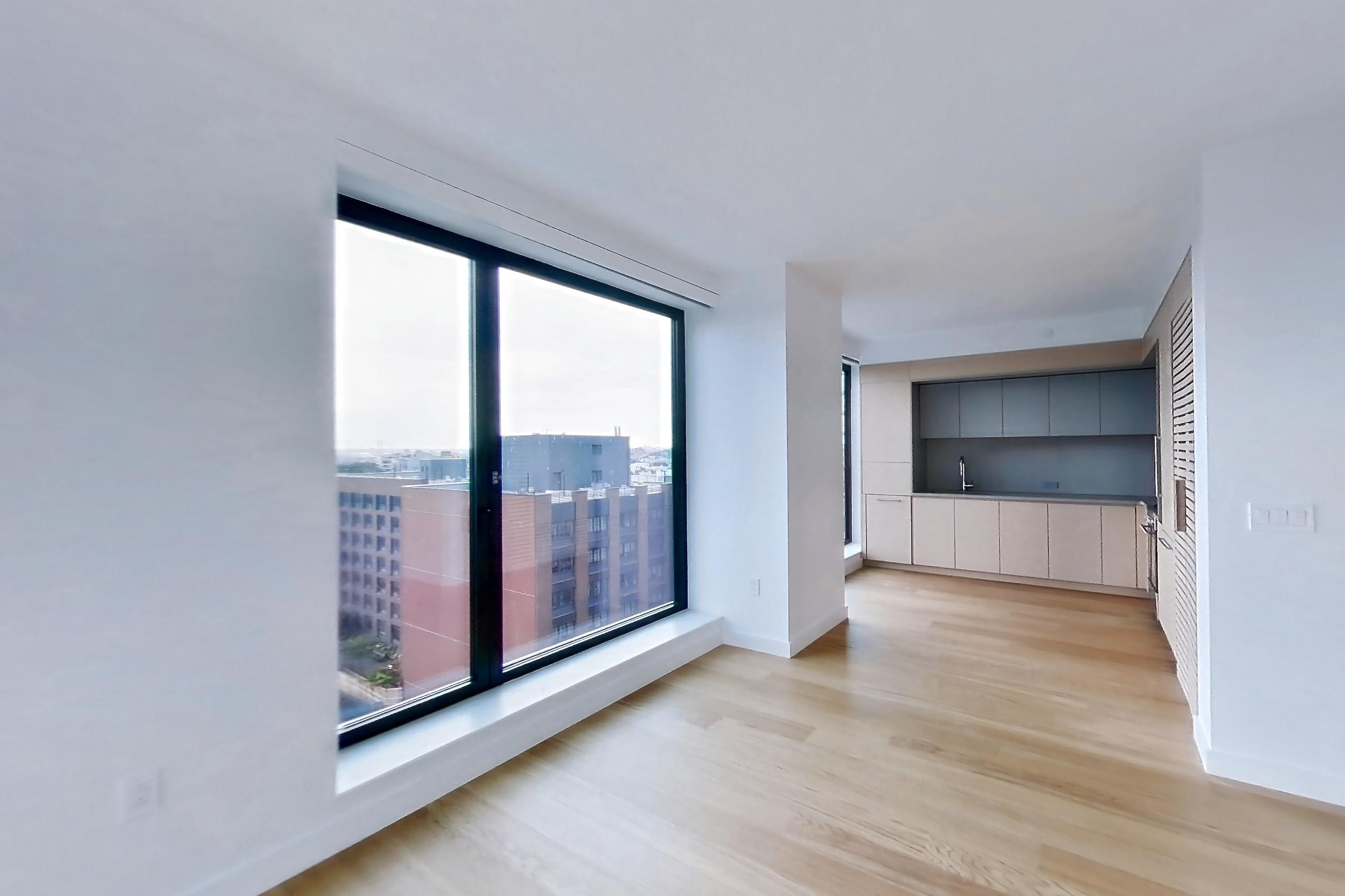Living room with city view and light wood-finish flooring, Apartment 2-0822 at Eagle + West