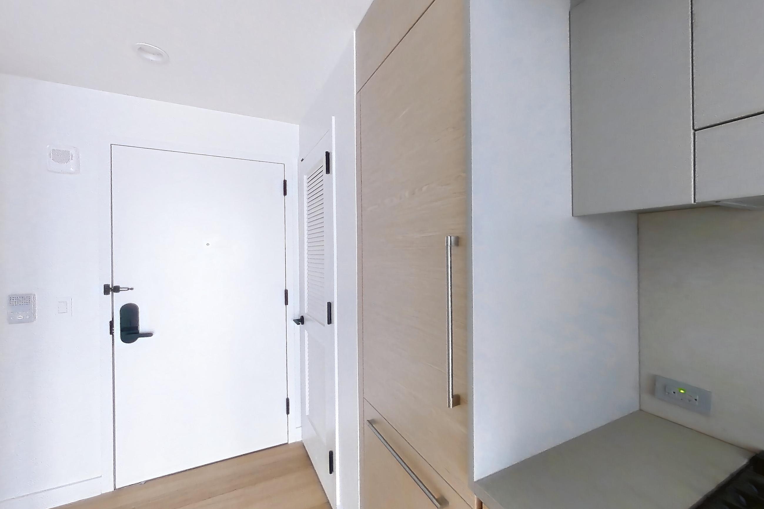Kitchen with gas range, light wood-finish flooring, oven/range, and stainless steel appliances, Apartment 2-0824 at Eagle + West
