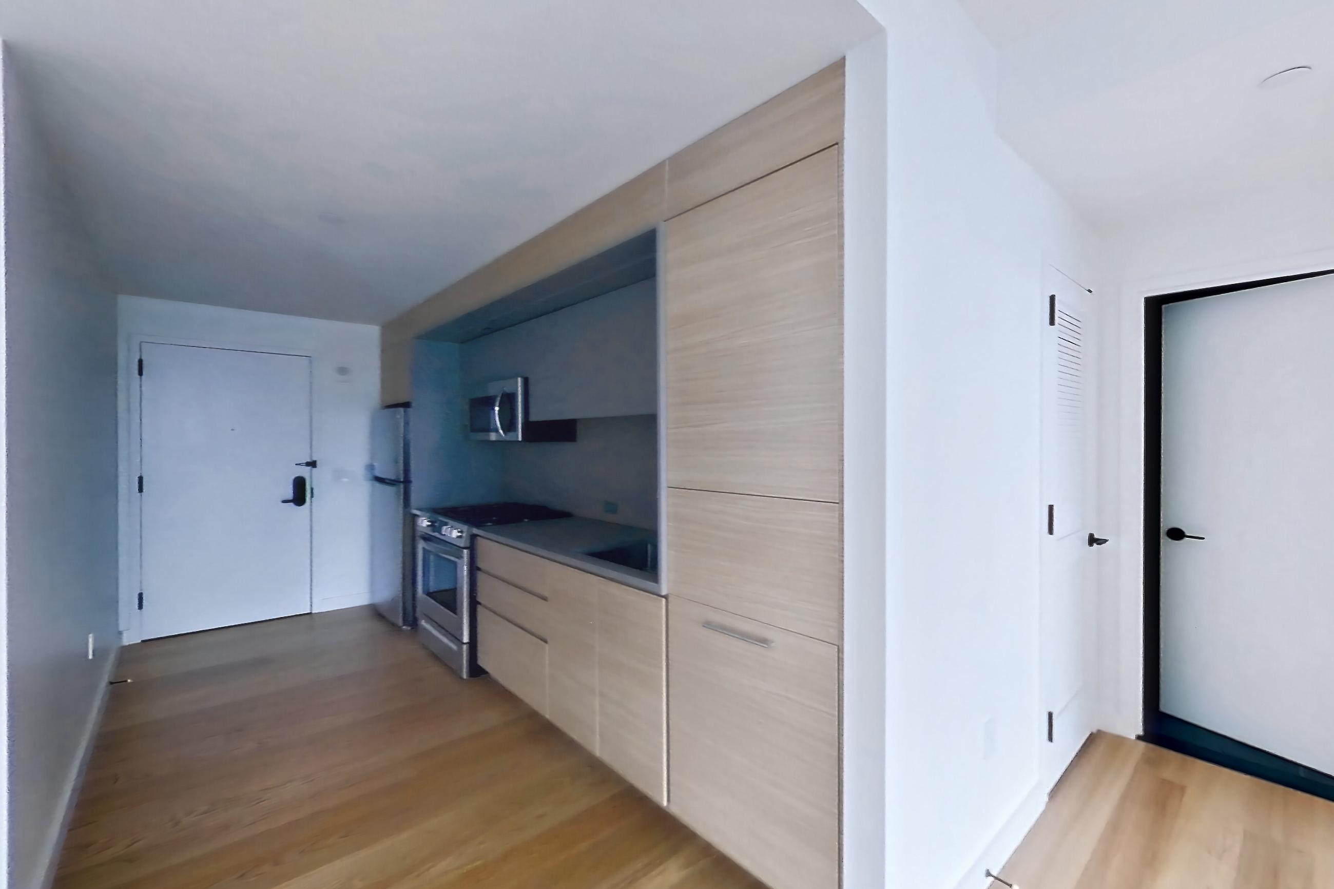 Living room with electric range, light wood-finish flooring, oven/range, and stainless steel appliances, Apartment 0937 at Eagle + West