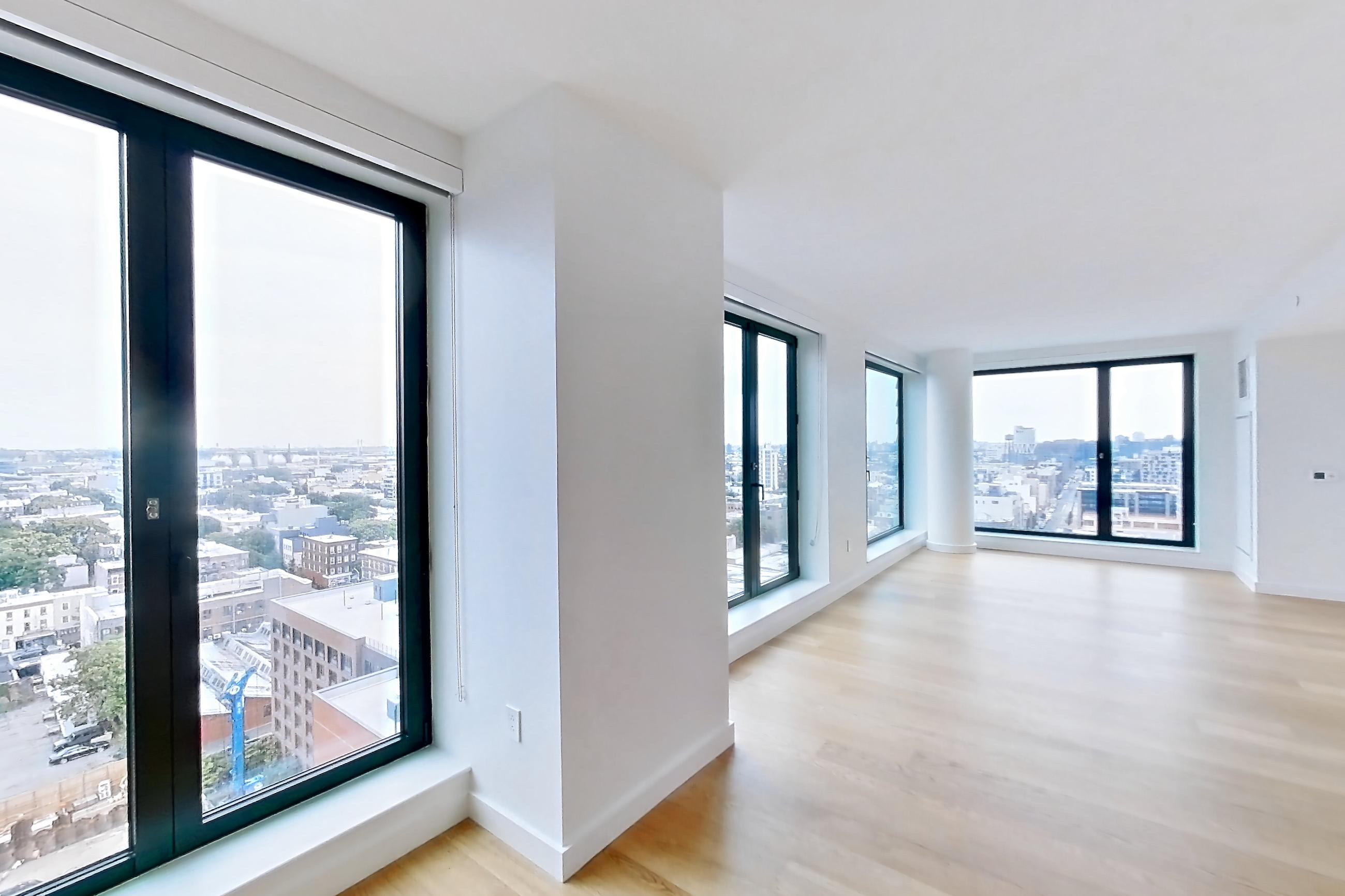Kitchen with city view, gas range, and light wood-finish flooring, Apartment 2-1521 at Eagle + West