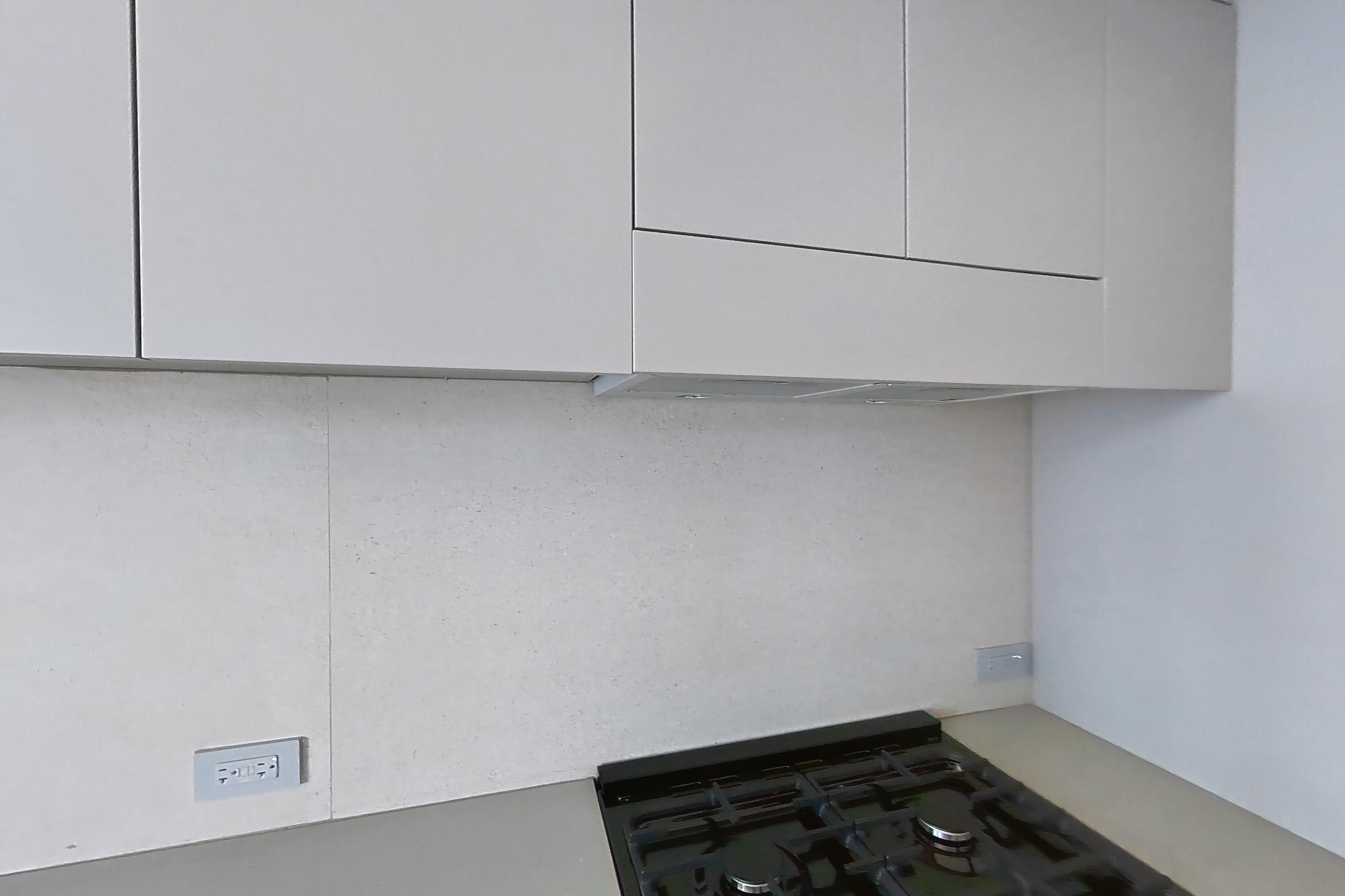 Kitchen with black appliances, gas range, light wood-finish flooring, and oven/range, Apartment 2-1523 at Eagle + West