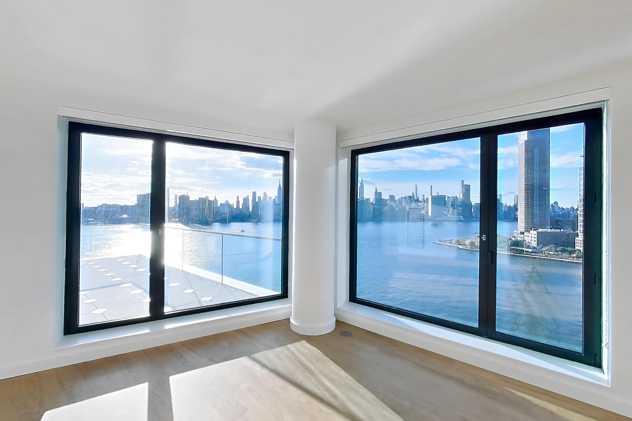 Living room with city view, gas range, light wood-finish flooring, oven/range, skyline view, and stainless steel appliances, Apartment 2-1526 at Eagle + West