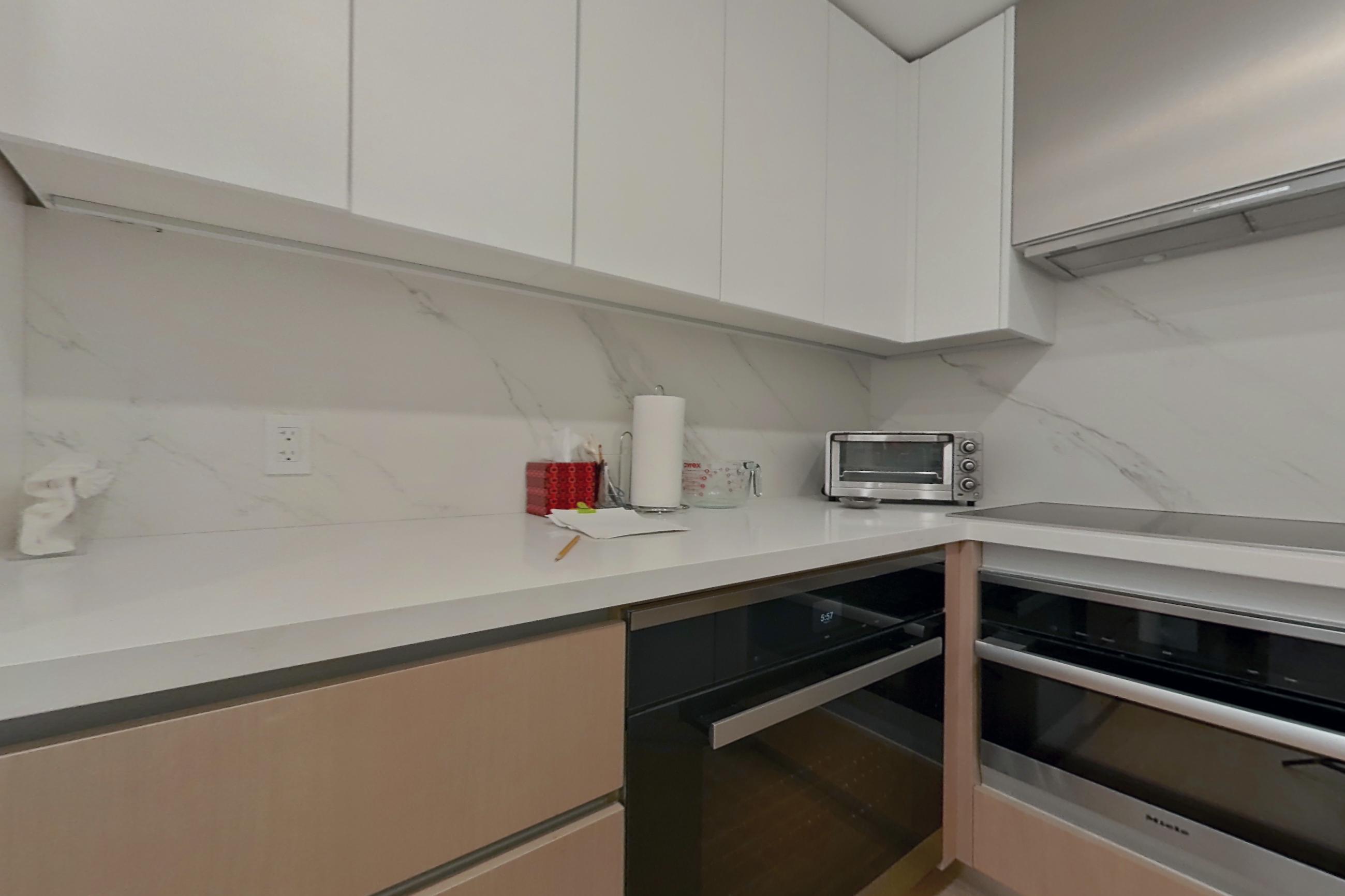 Kitchen with black appliances and oven/range, Apartment 304 at Royal Poinciana South