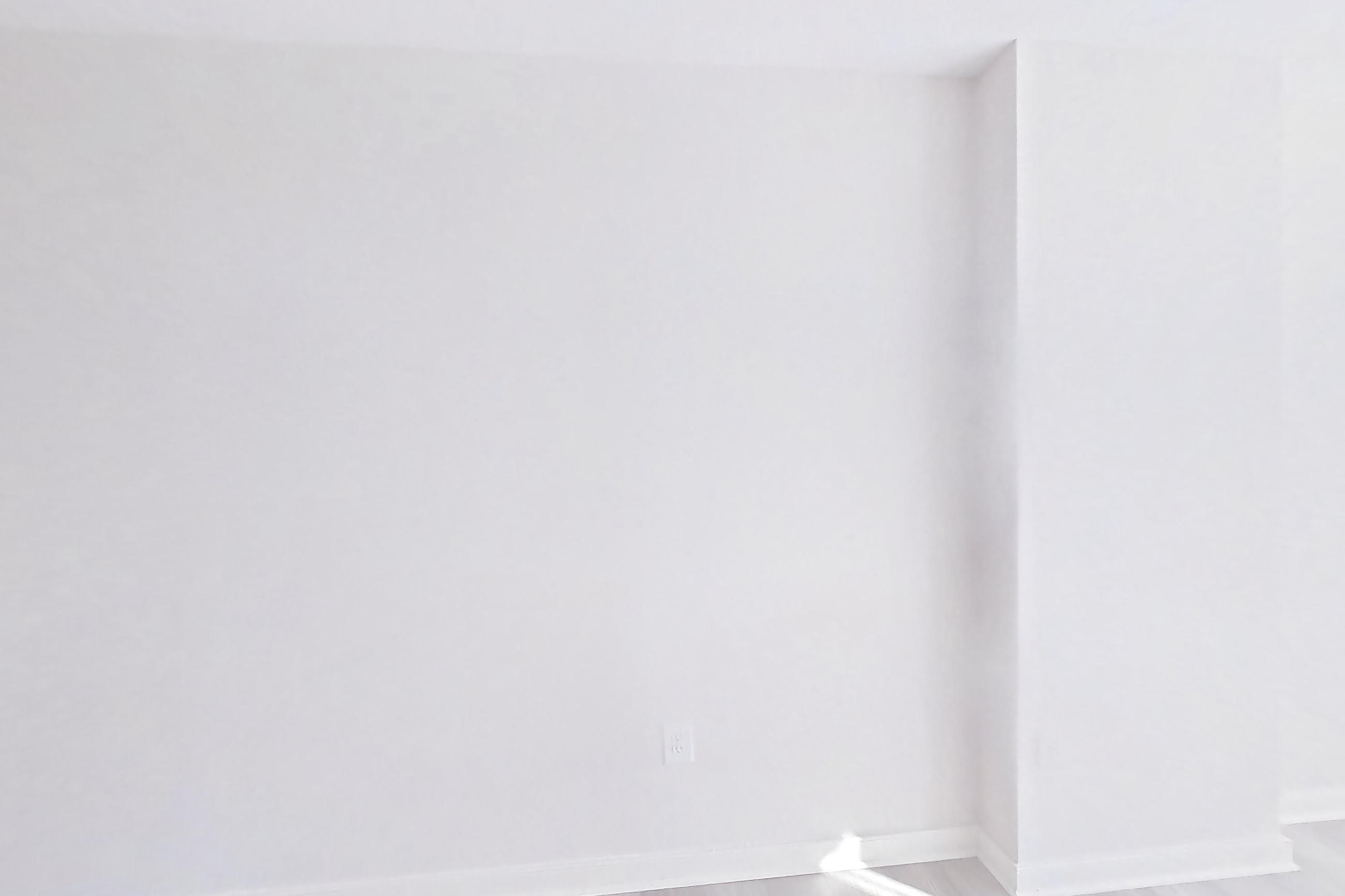 Living space with light wood-finish flooring, Apartment 911 at The Barton at Woodley