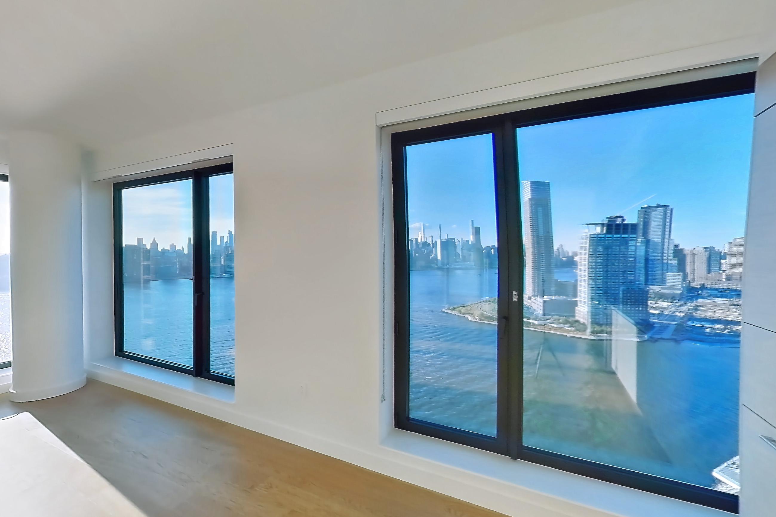 Kitchen with city view, gas range, oven/range, skyline view, and stainless steel appliances, Apartment 2-2626 at Eagle + West