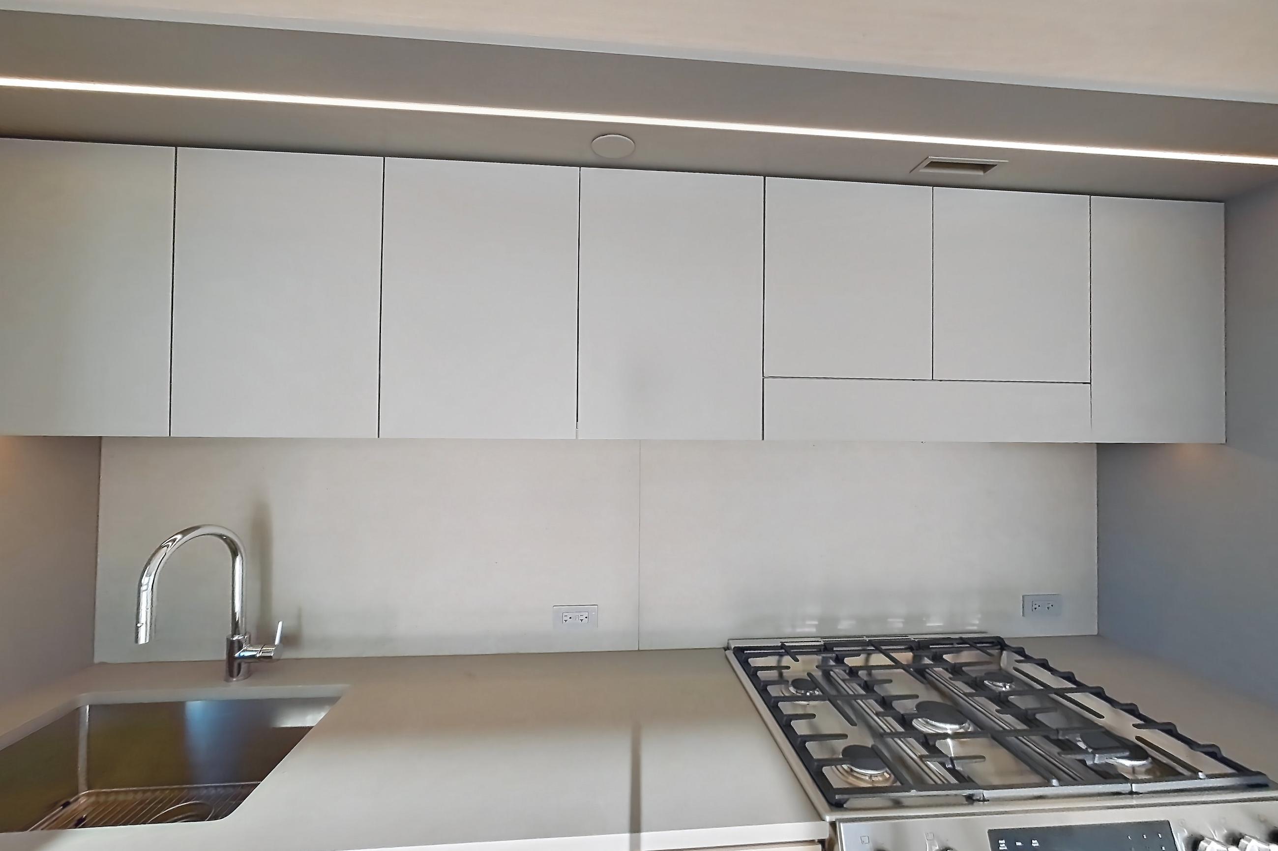Kitchen with city view, gas range, oven/range, skyline view, and stainless steel appliances, Apartment 2-2626 at Eagle + West