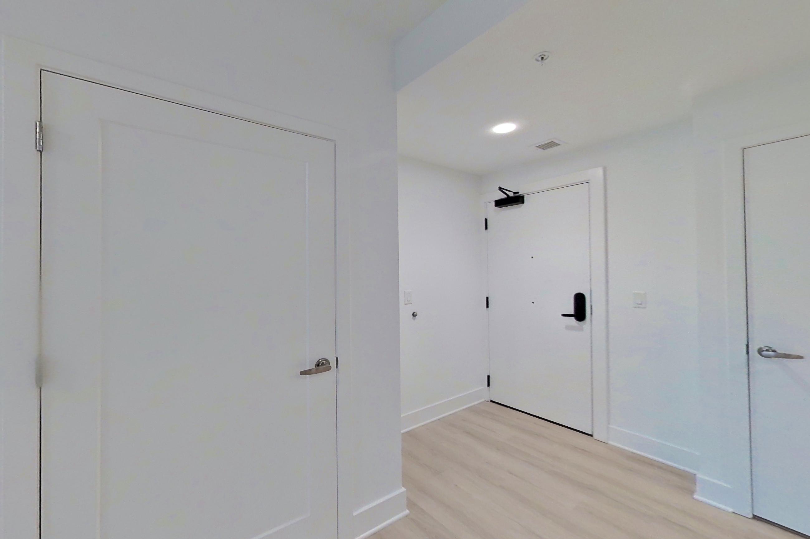 Kitchen with light wood-finish flooring, Apartment 322 at SoNYa