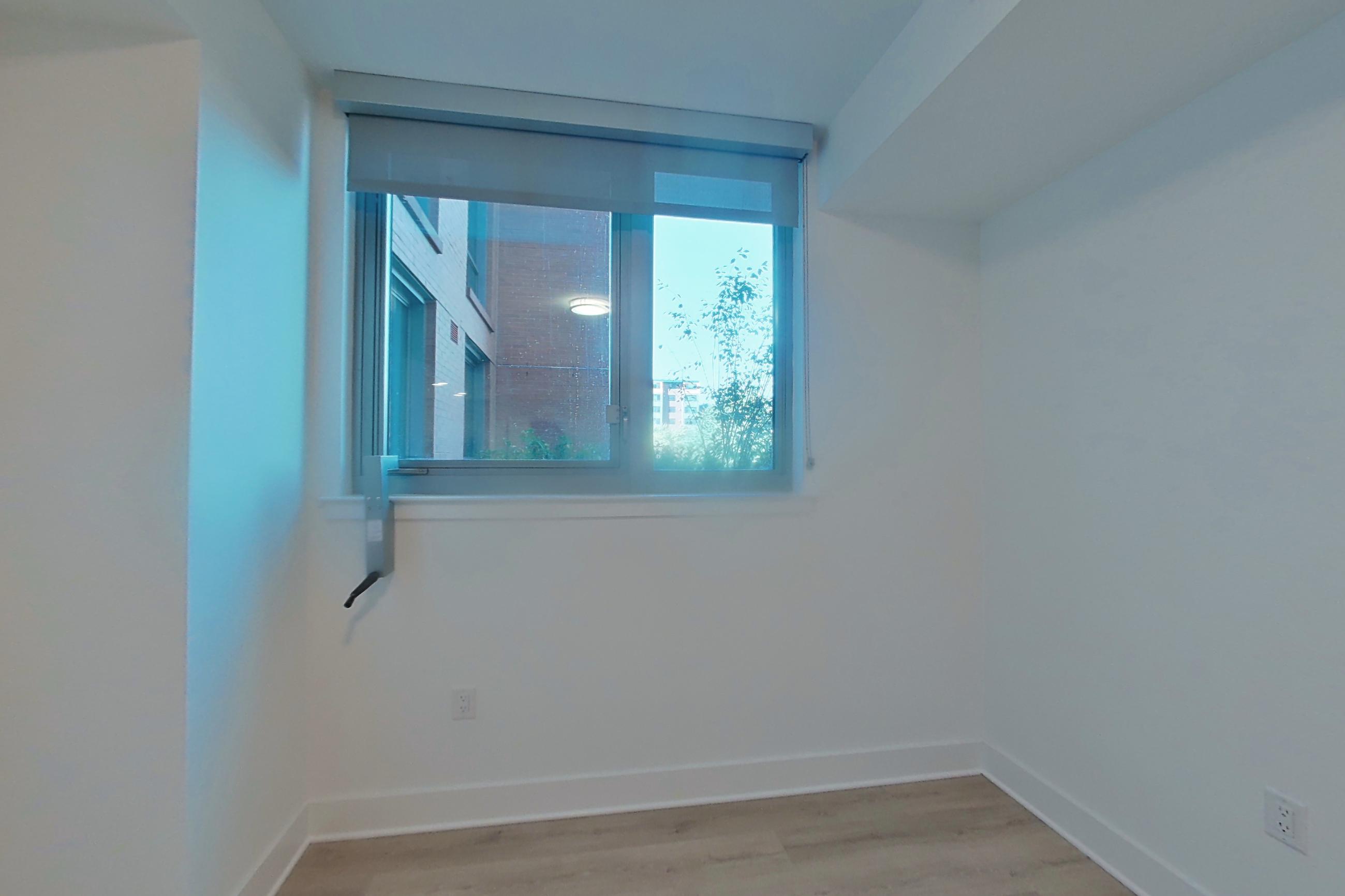 Living space with light wood-finish flooring, Apartment 322 at SoNYa