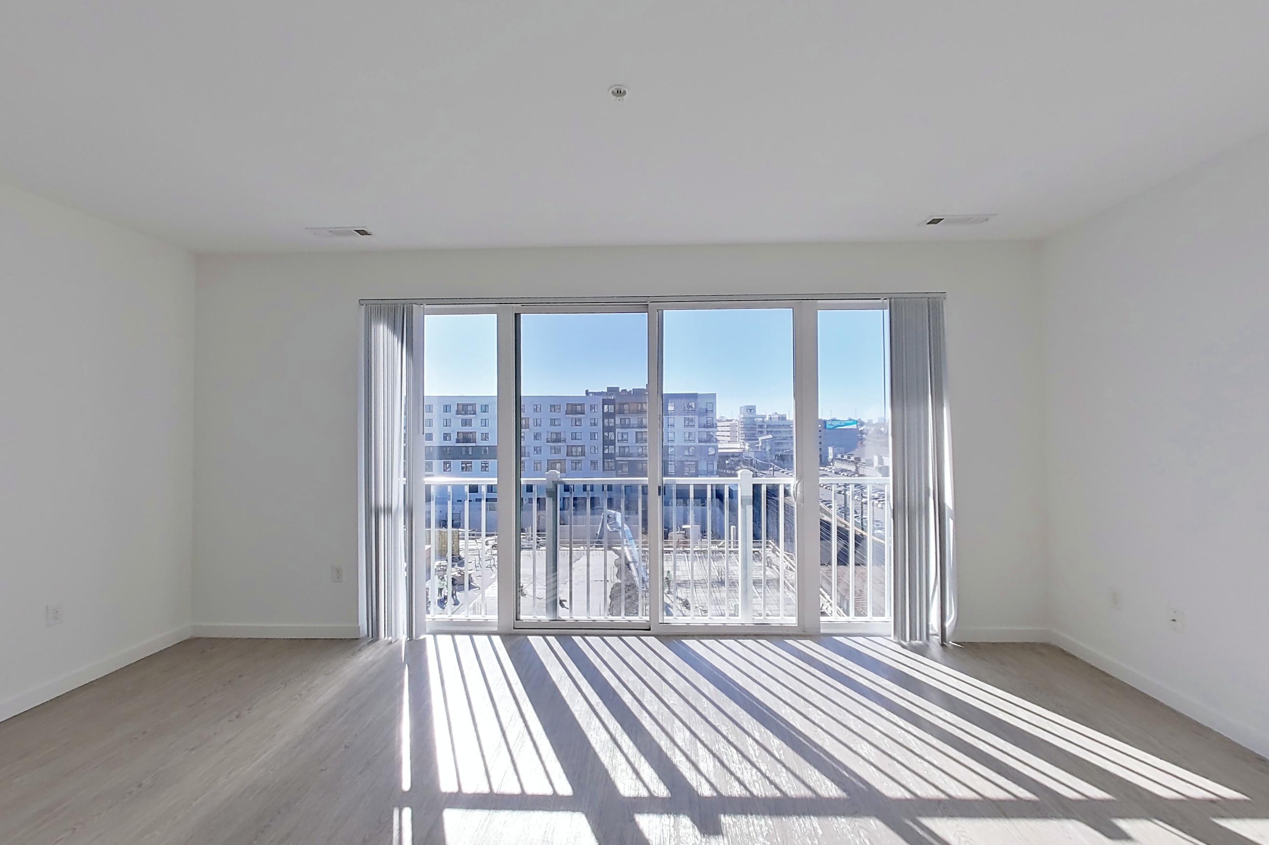 Living space with dark wood-finish flooring, Apartment 613 at Ocean 650