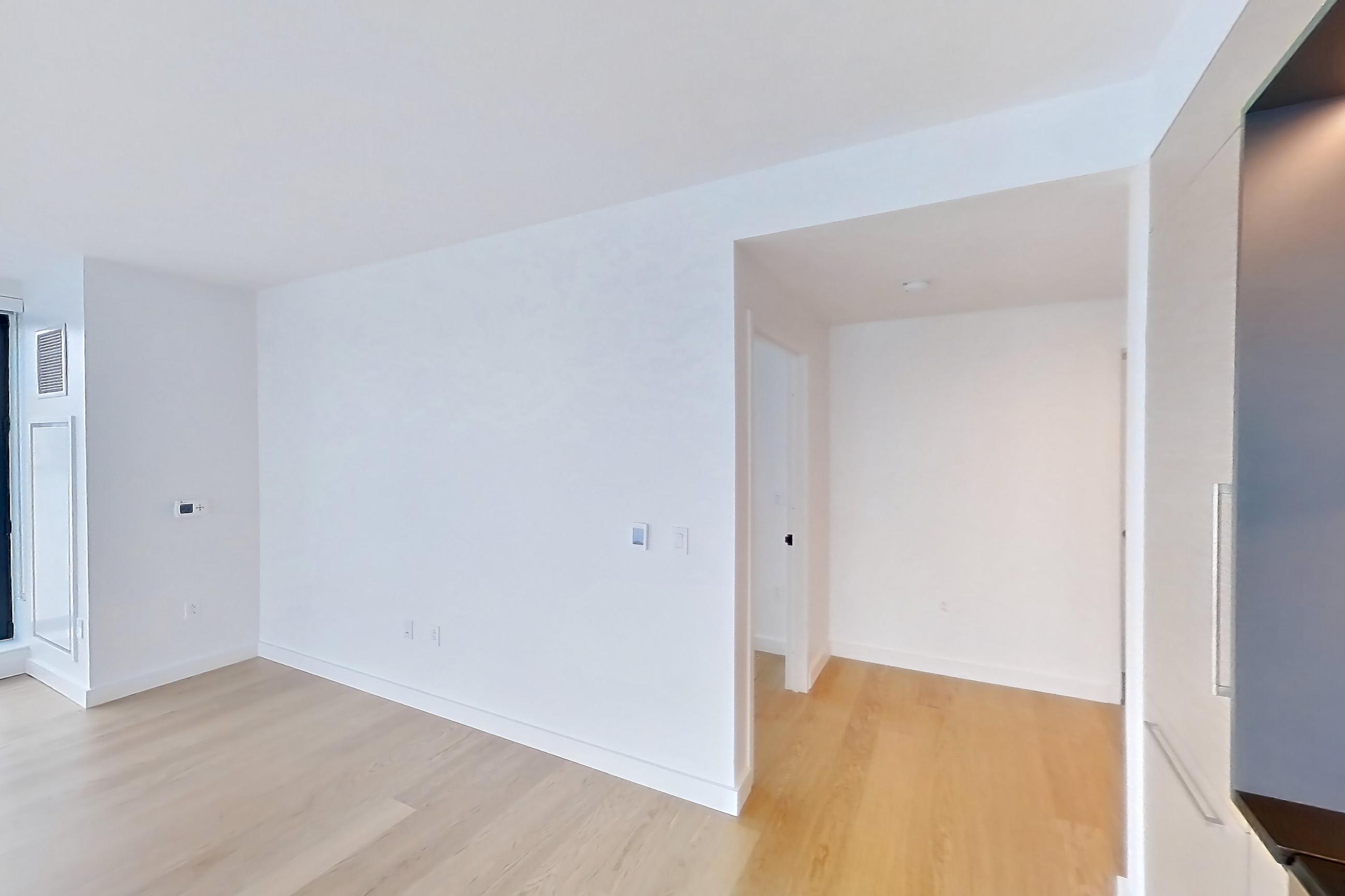 Kitchen with gas cooktop and light wood-finish flooring, Apartment 1-1604 at Eagle + West