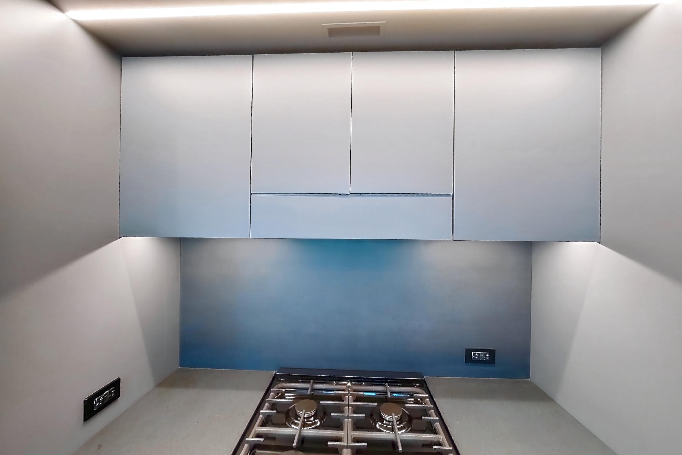 Kitchen with gas range, light wood-finish flooring, oven/range, and stainless steel appliances, Apartment 1-1905 at Eagle + West