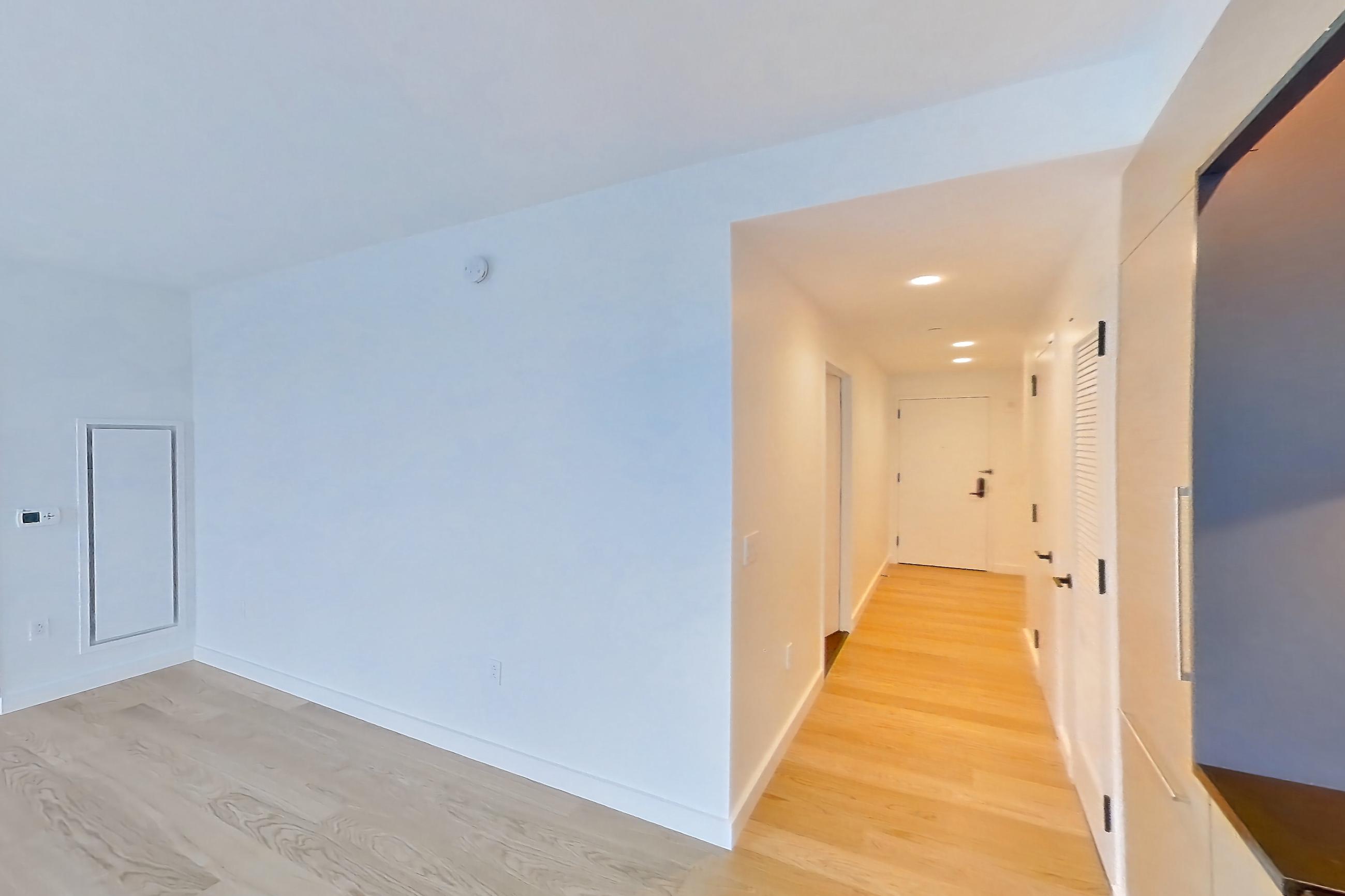 Kitchen with gas cooktop and light wood-finish flooring, Apartment 1-1907 at Eagle + West