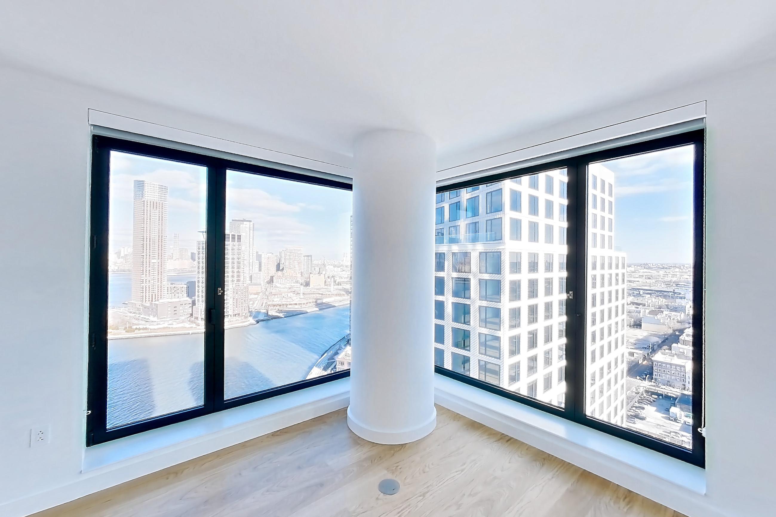 Living room with city view, Apartment 1-2607 at Eagle + West