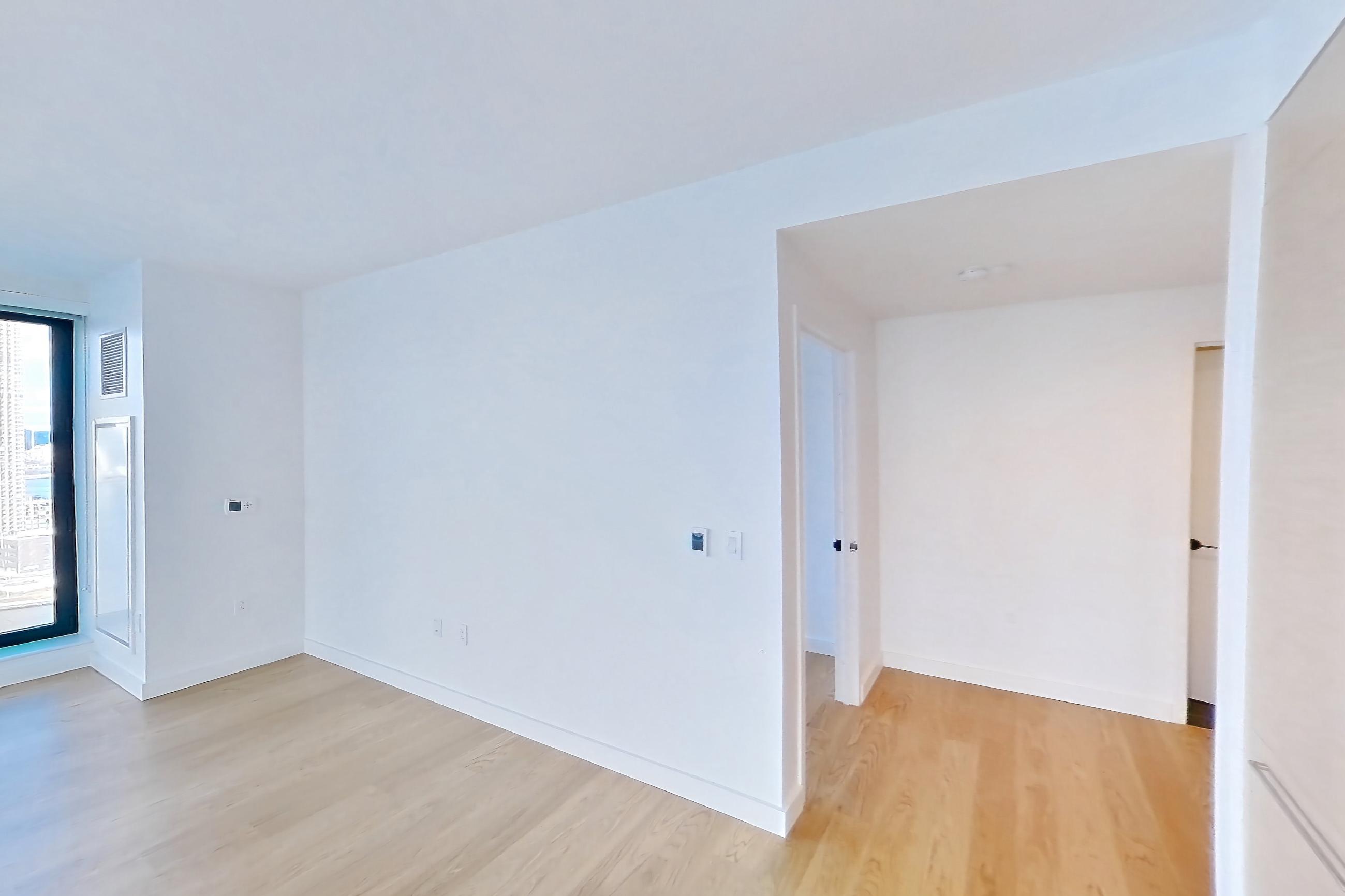 Kitchen with gas range, light wood-finish flooring, oven/range, and stainless steel appliances, Apartment 1-2604 at Eagle + West