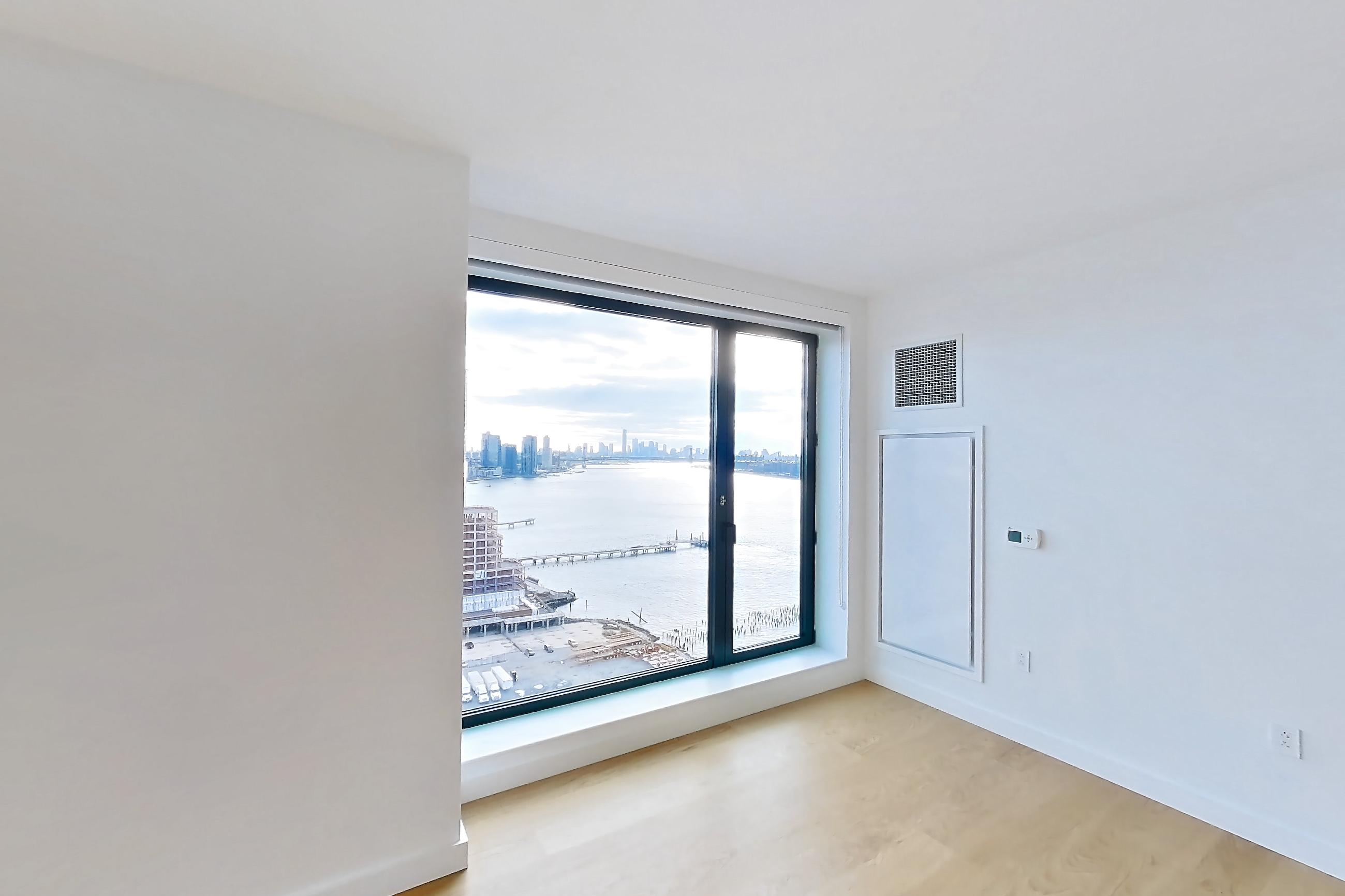 Living room with water view, Apartment 1-2501 at Eagle + West