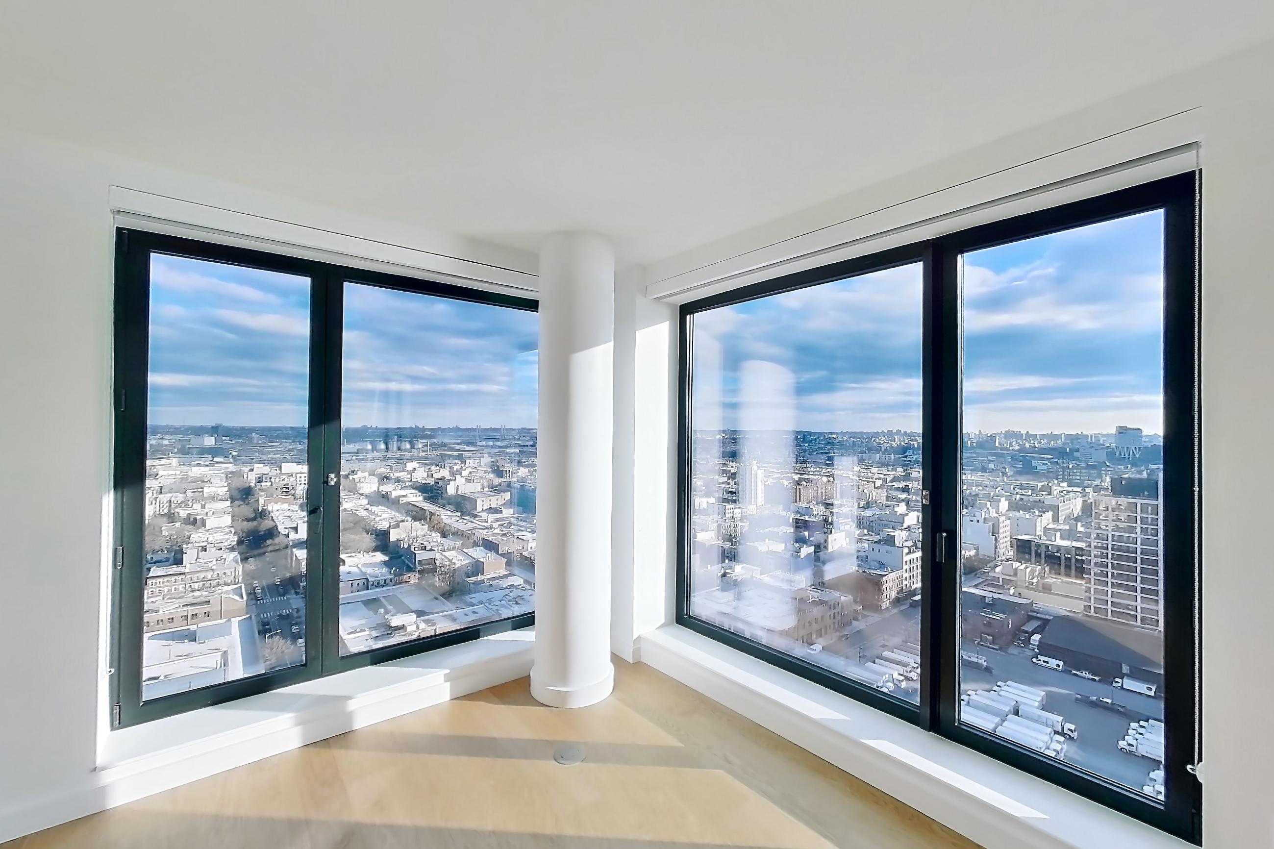 Living room with city view, Apartment 1-2408 at Eagle + West