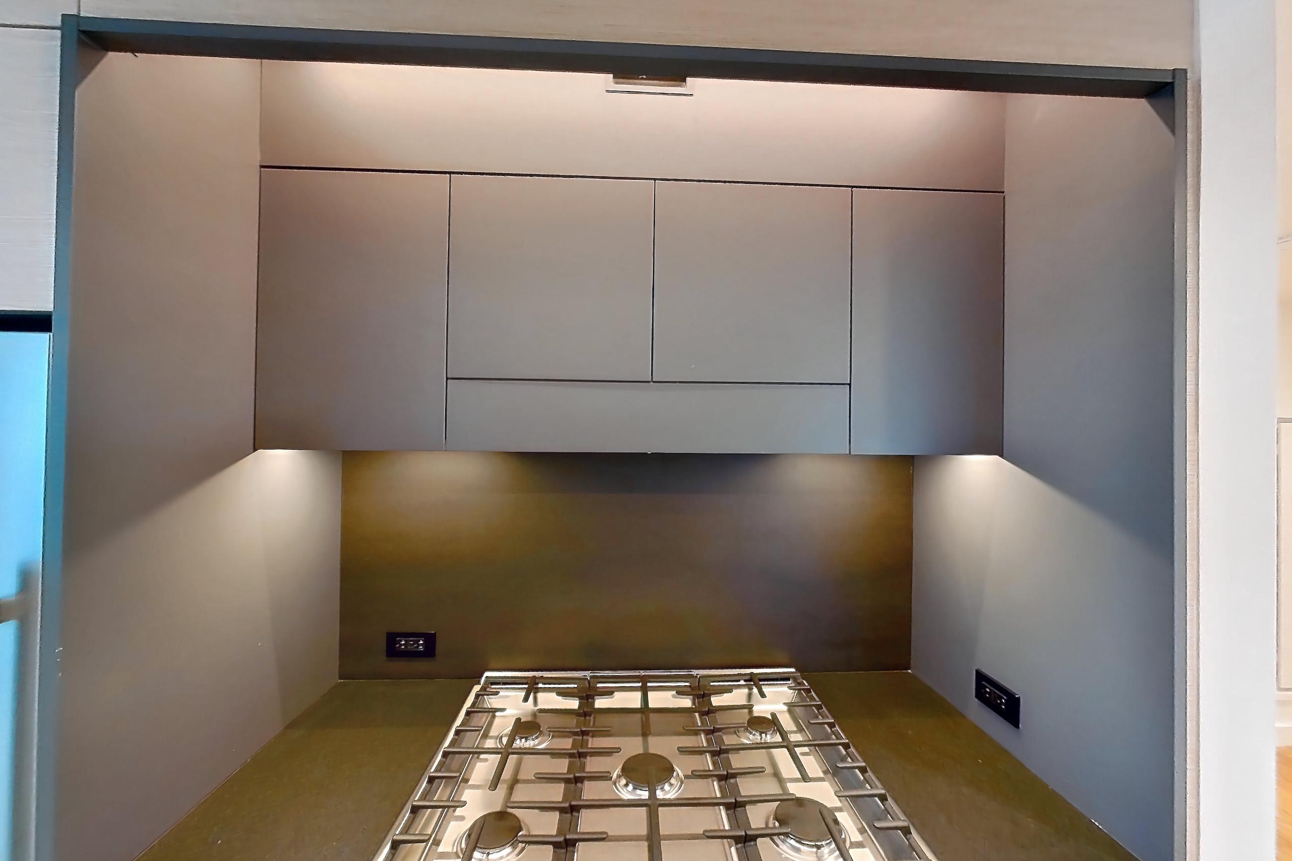 Kitchen with gas range, oven/range, and stainless steel appliances, Apartment 1-2308 at Eagle + West
