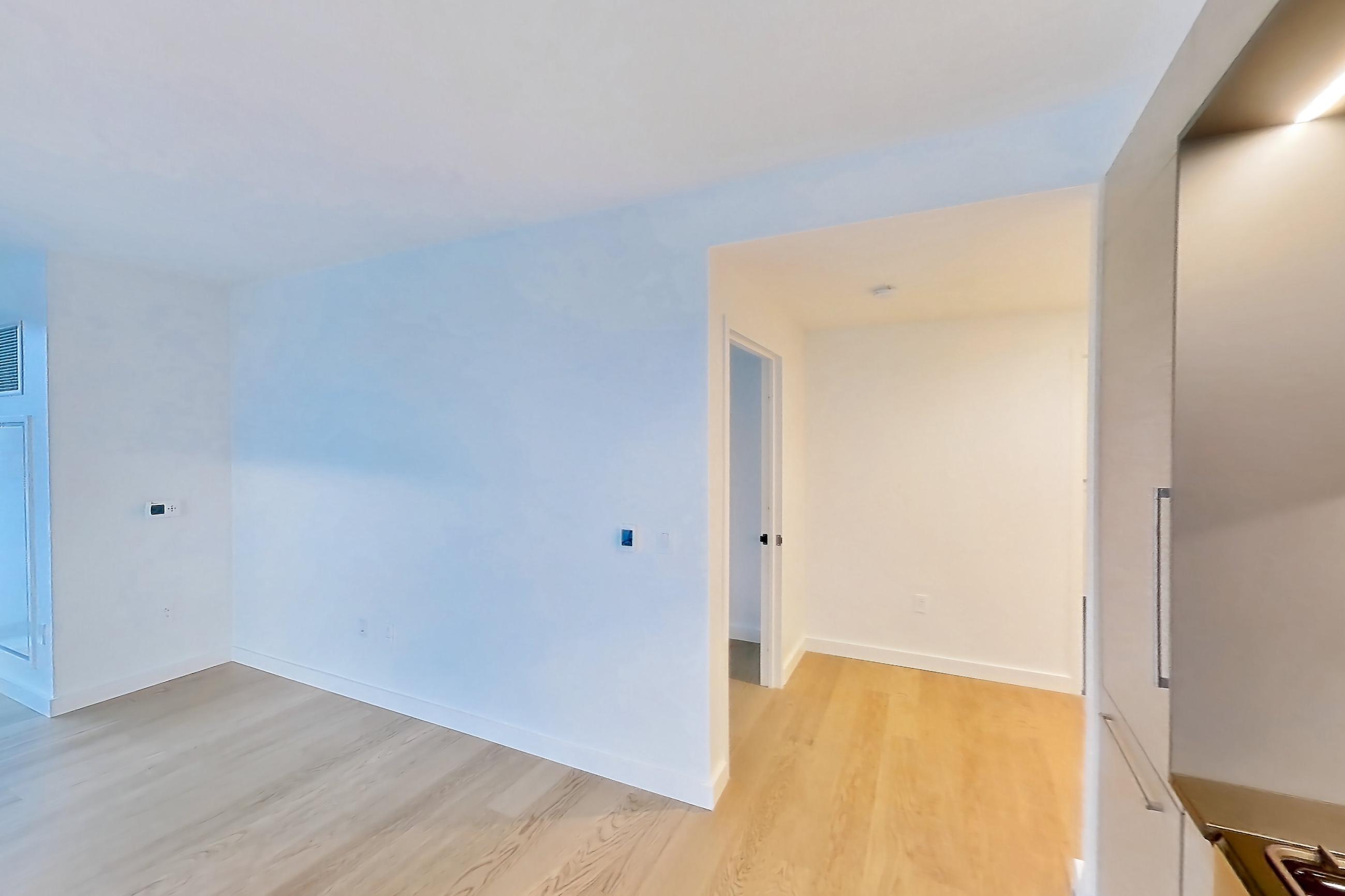 Kitchen with light wood-finish flooring, Apartment 1-2304 at Eagle + West