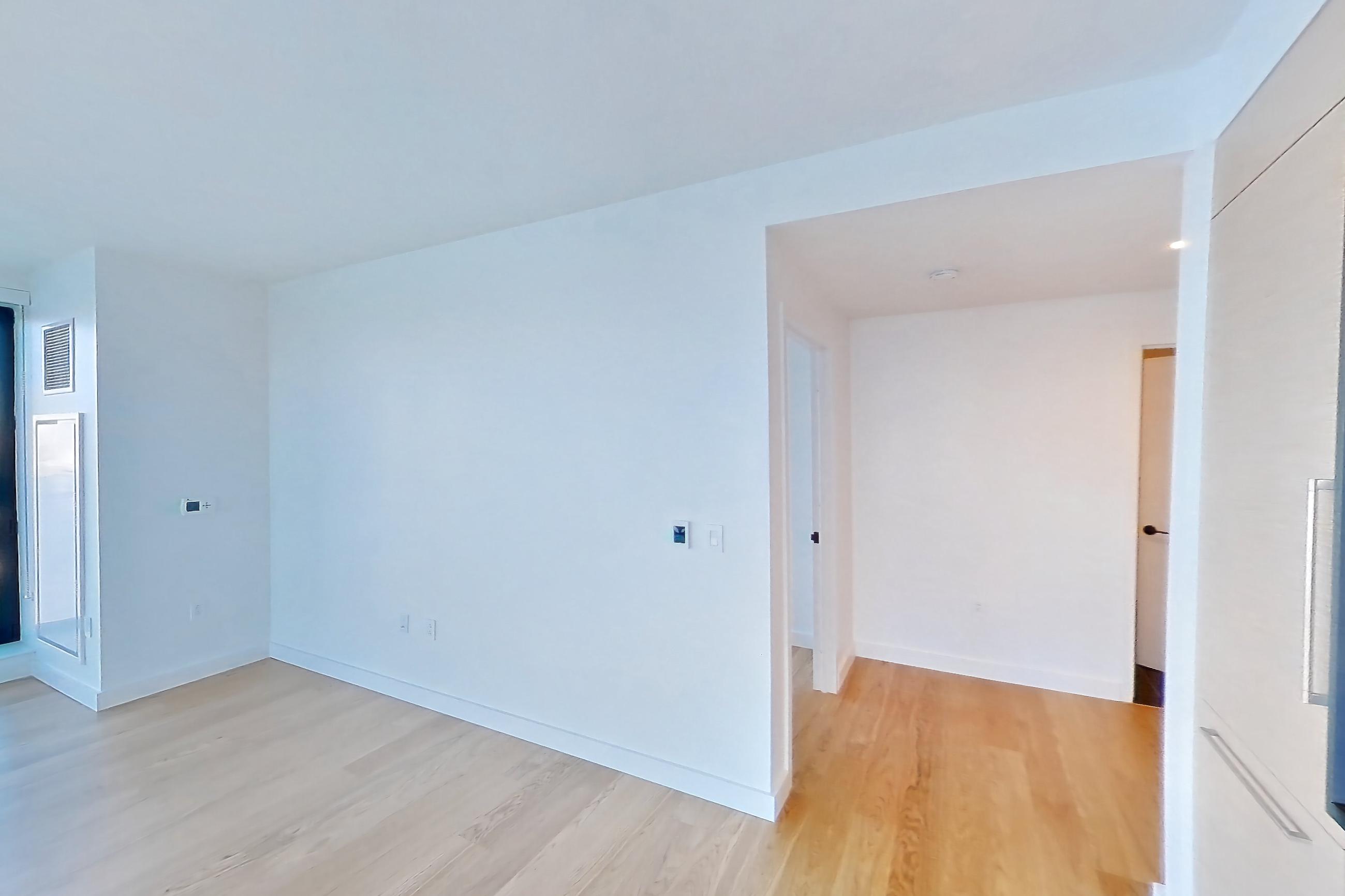 Kitchen with gas range and light wood-finish flooring, Apartment 1-2204 at Eagle + West