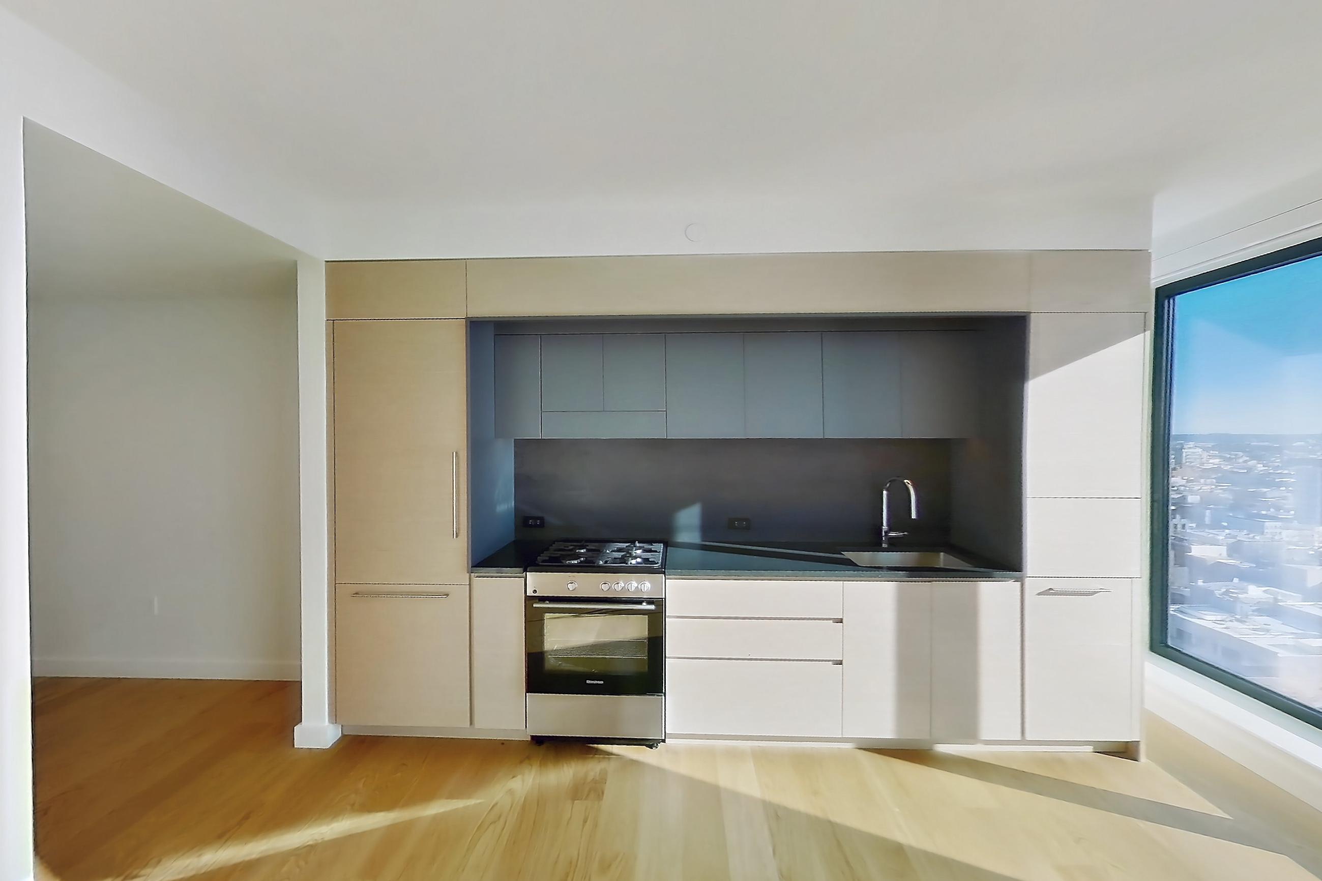 Living space with light wood-finish flooring, Apartment 1-2001 at Eagle + West