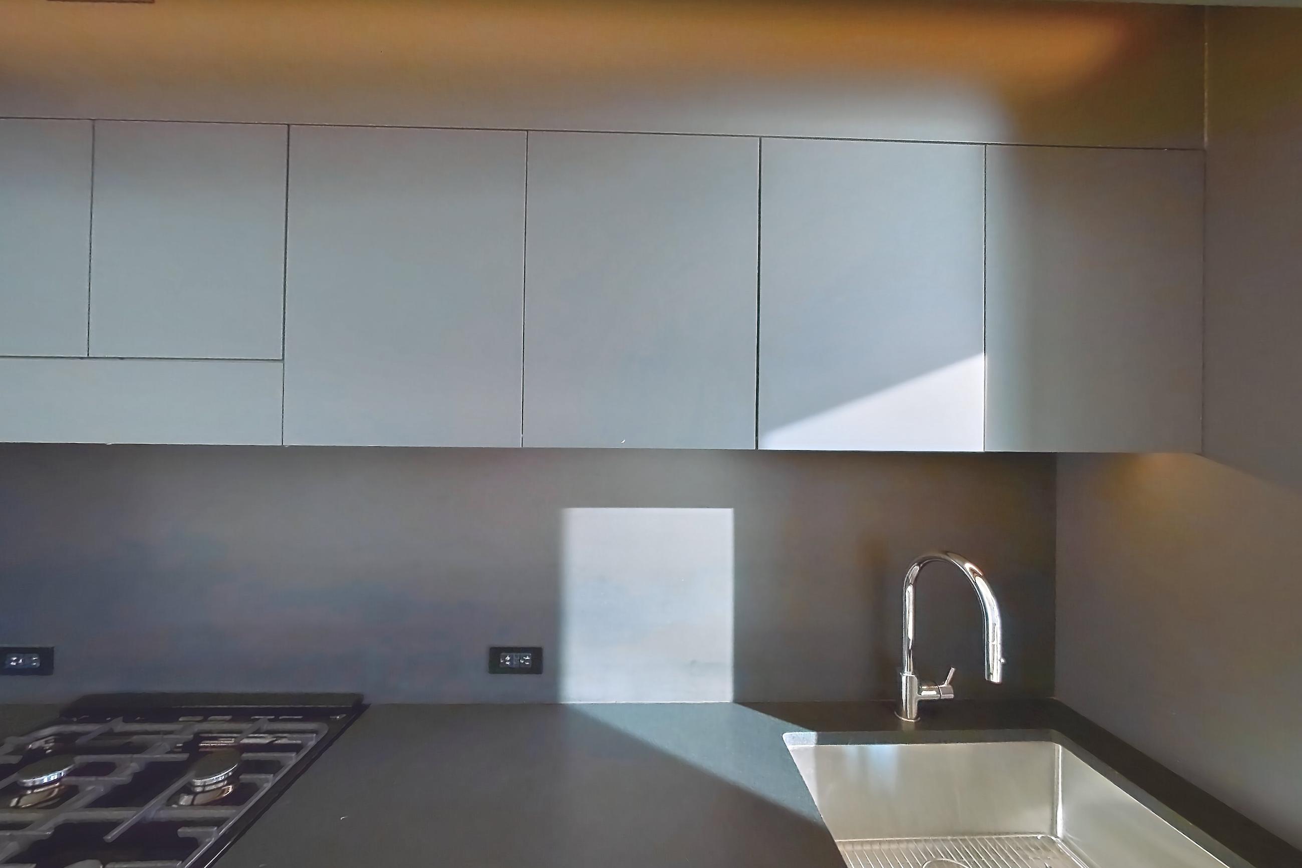 Kitchen with gas range and light wood-finish flooring, Apartment 1-1801 at Eagle + West