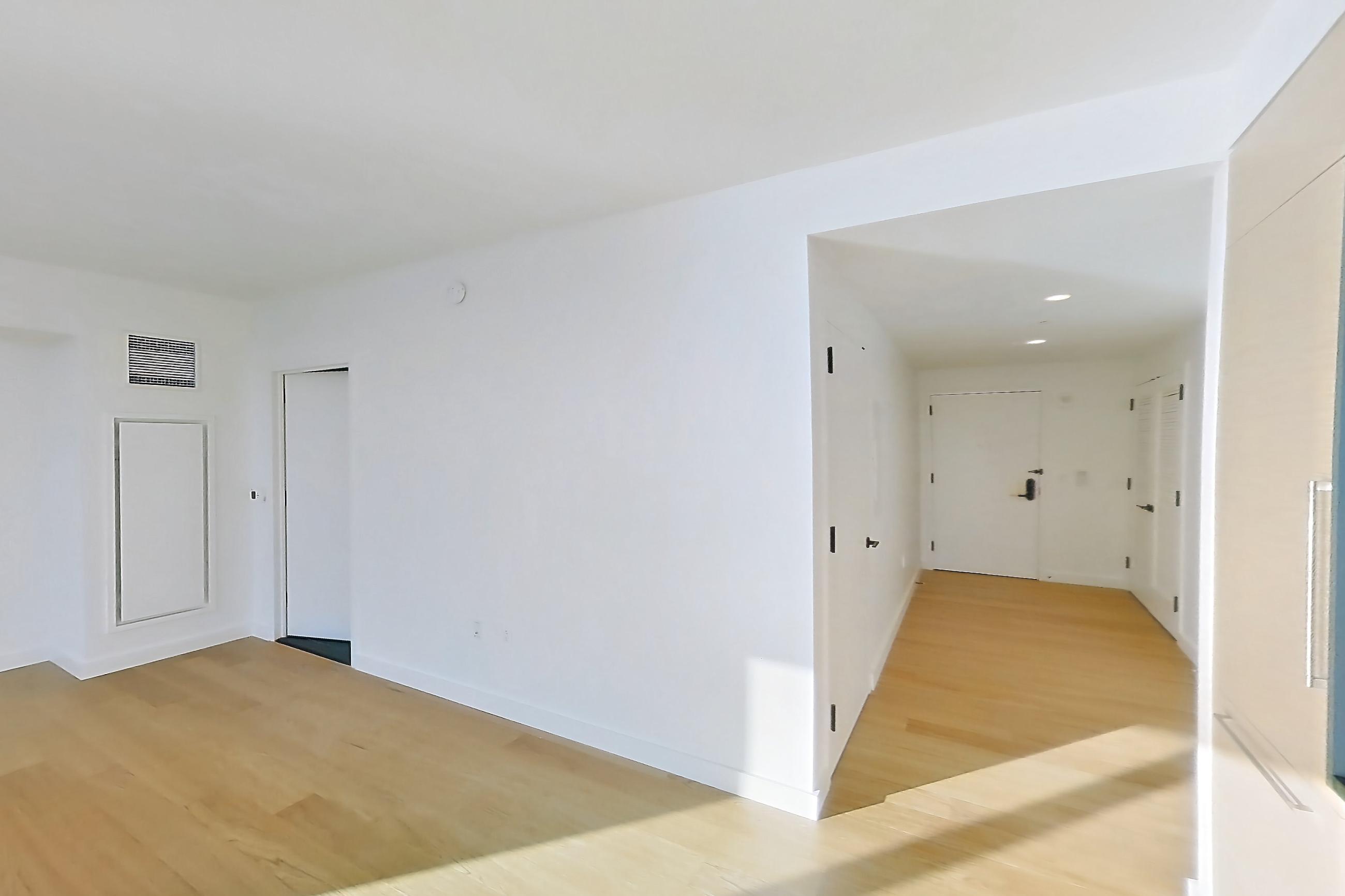 Kitchen with gas range and light wood-finish flooring, Apartment 1-1801 at Eagle + West