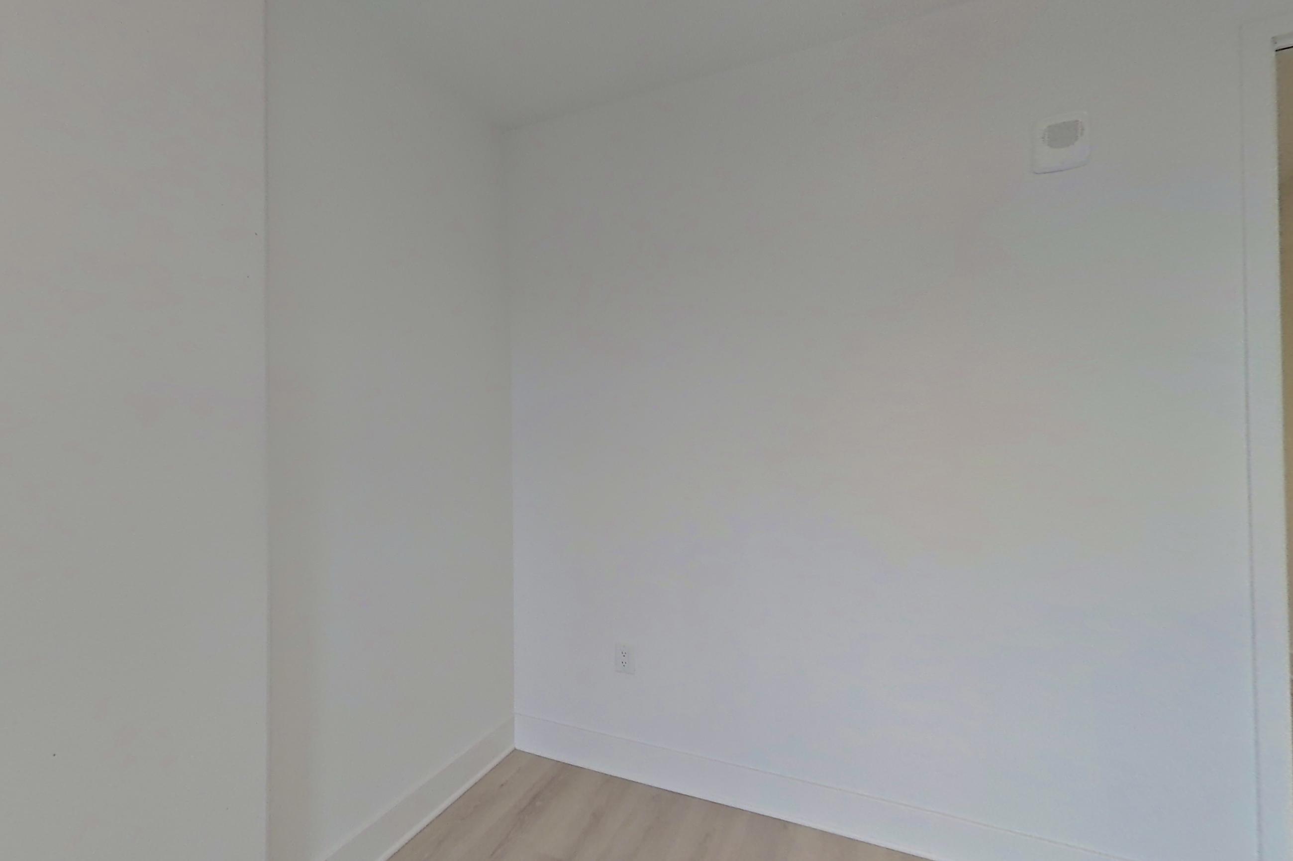 Living room with city view and light wood-finish flooring, Apartment 420 at SoNYa