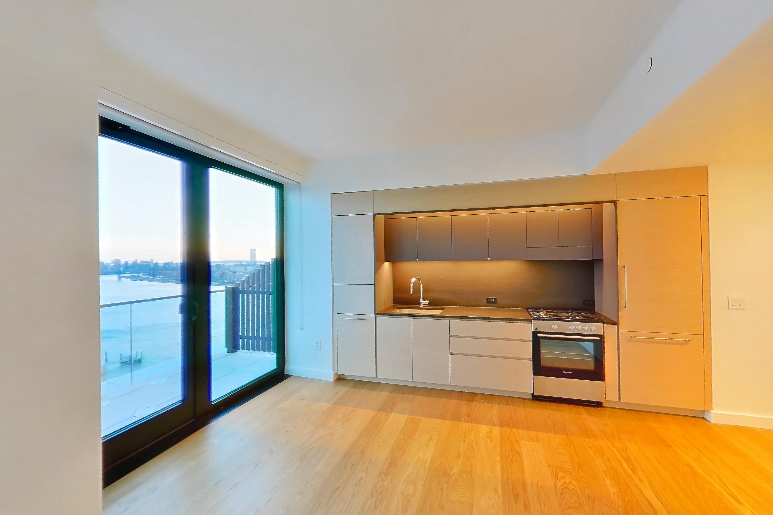 Living space with city view and light wood-finish flooring, Apartment 1-PH4A at Eagle + West
