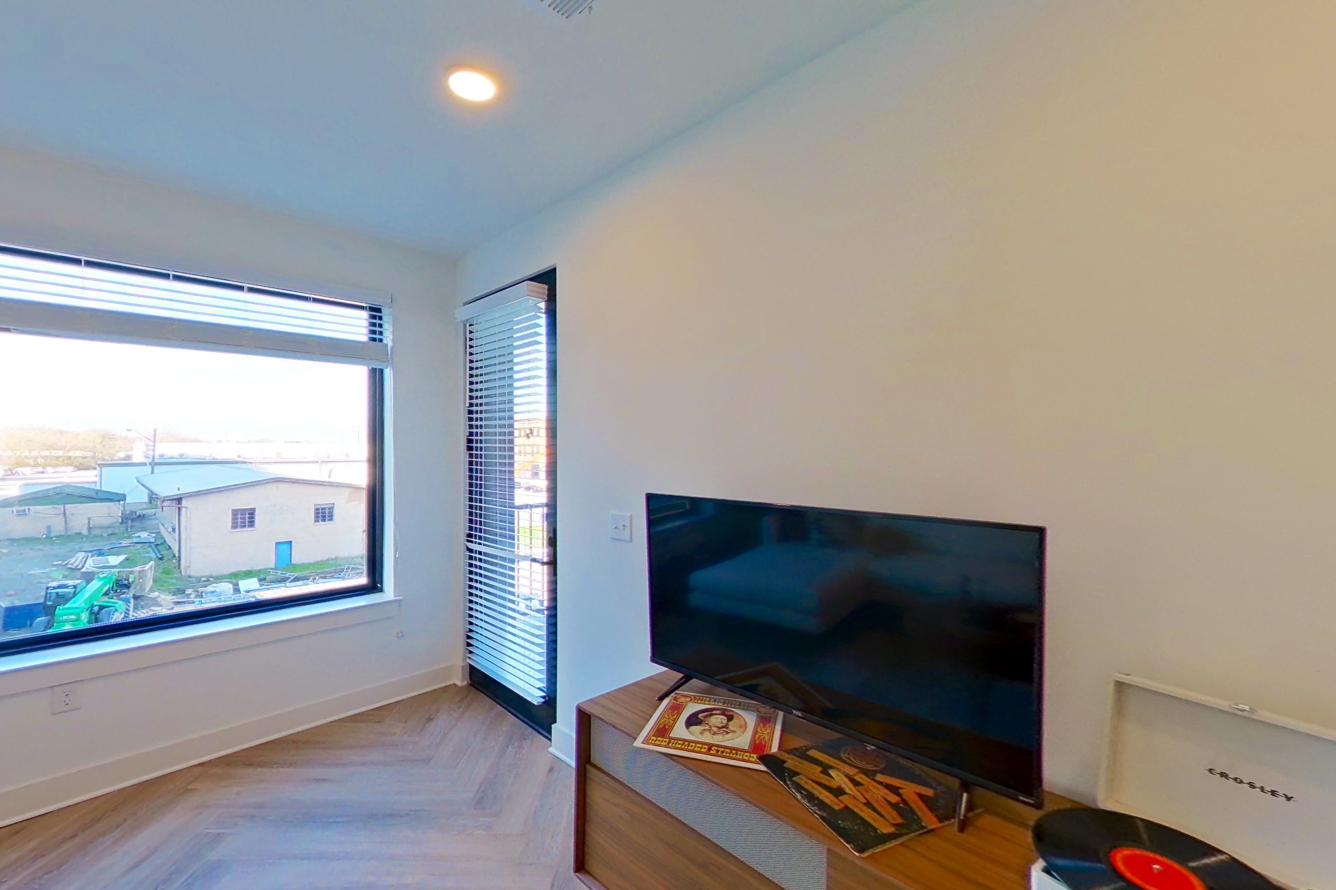 Living room with parquet flooring, Apartment 317 at Standard Assembly