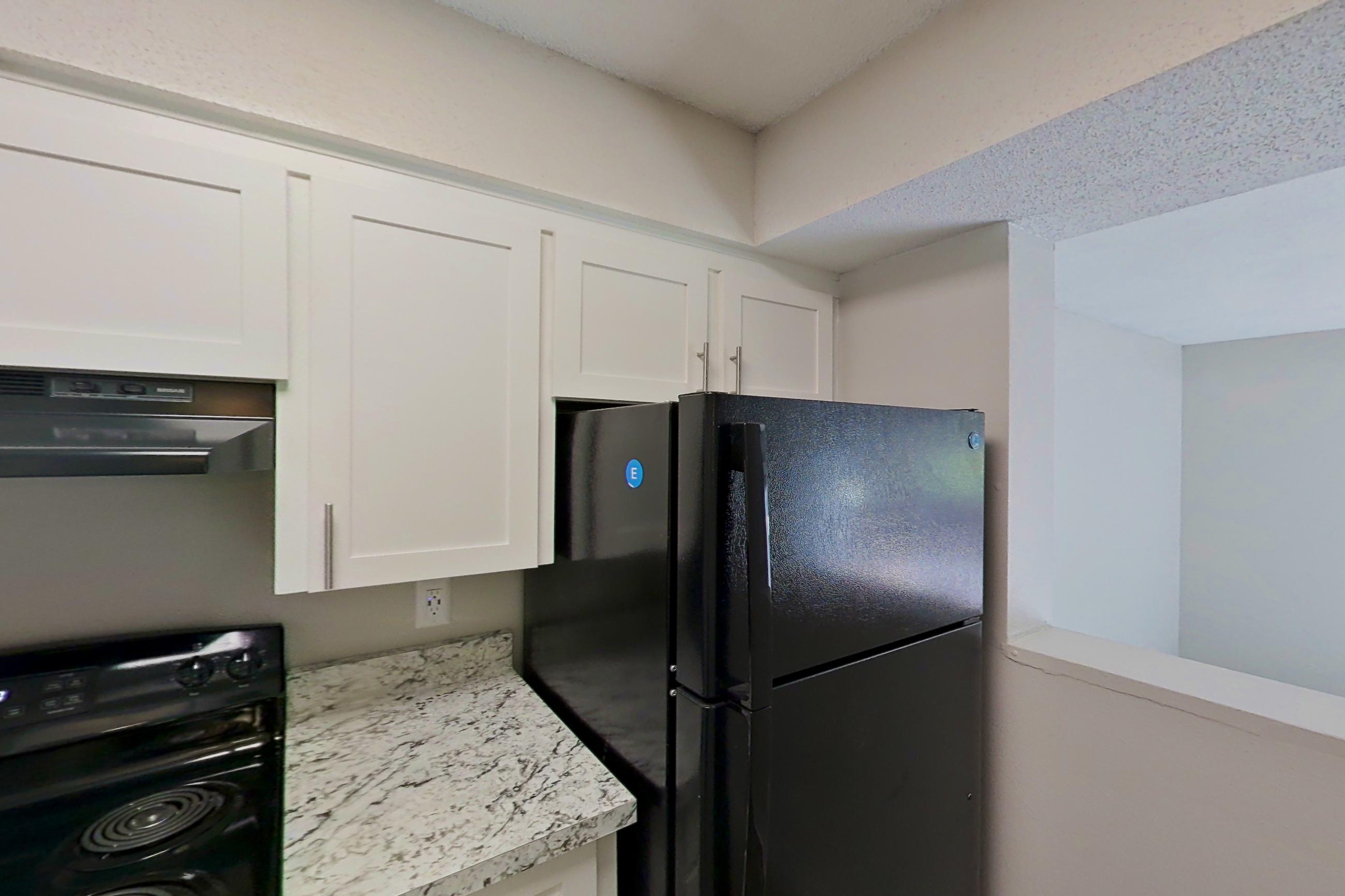Kitchen in a 1x1 C Elite floor plan apartment, representative of Apartment 1524A at The Life at Legacy Fountains