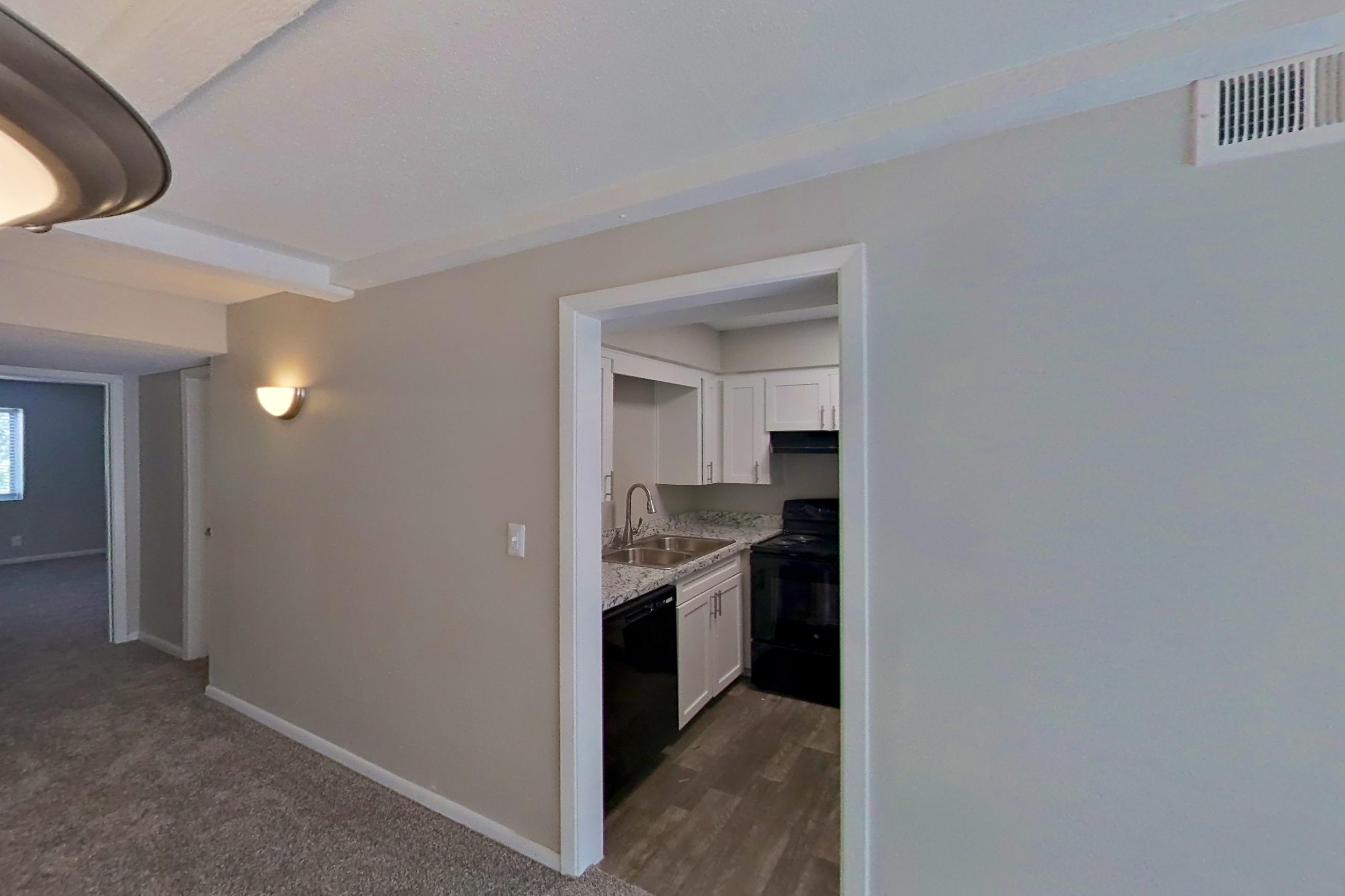 Living space in a 1x1 C Elite floor plan apartment, representative of Apartment 1524A at The Life at Legacy Fountains