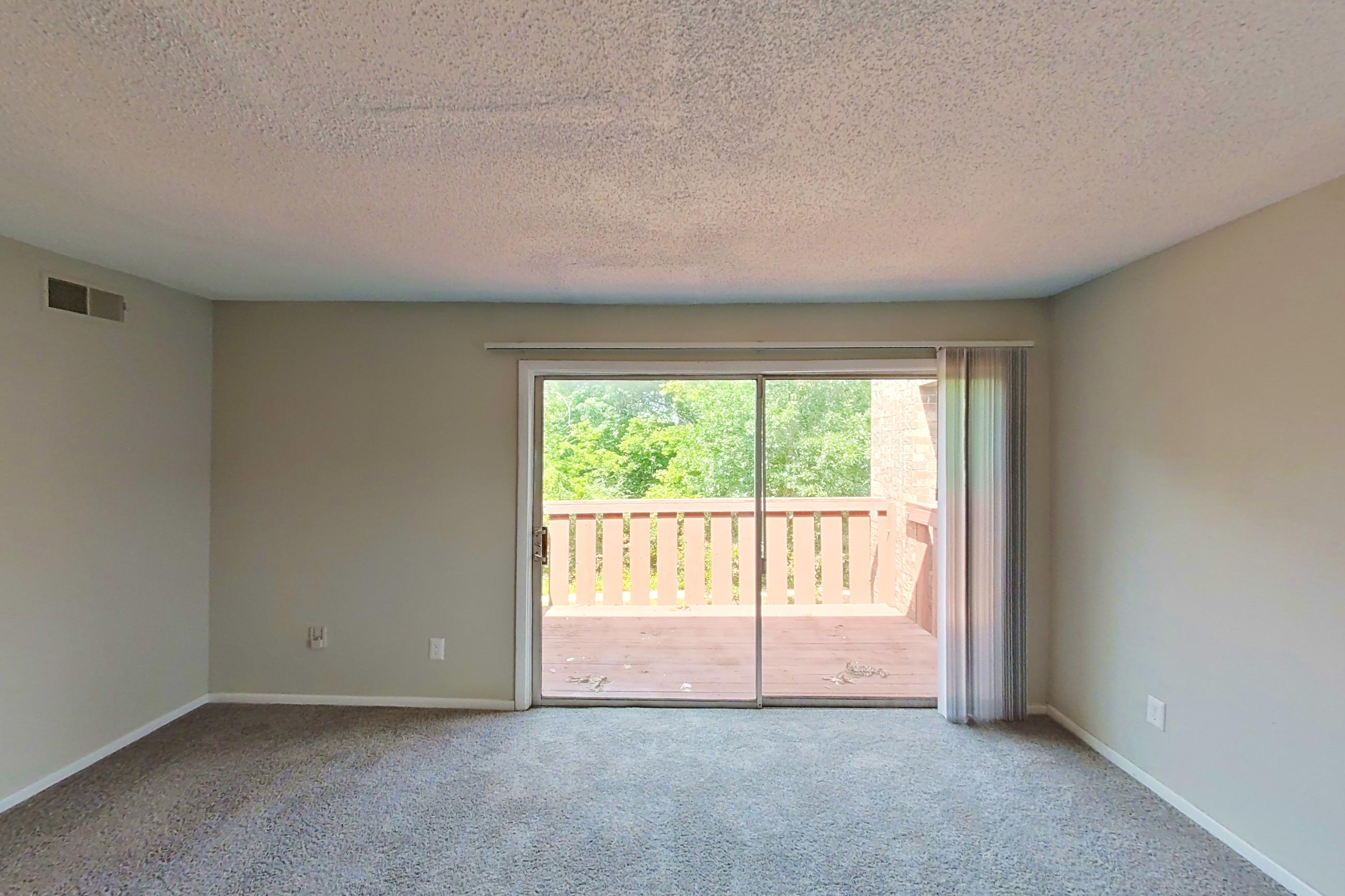 Living room in a 2x1 B Elite floor plan apartment, representative of Apartment 9610D at The Life at Legacy Fountains