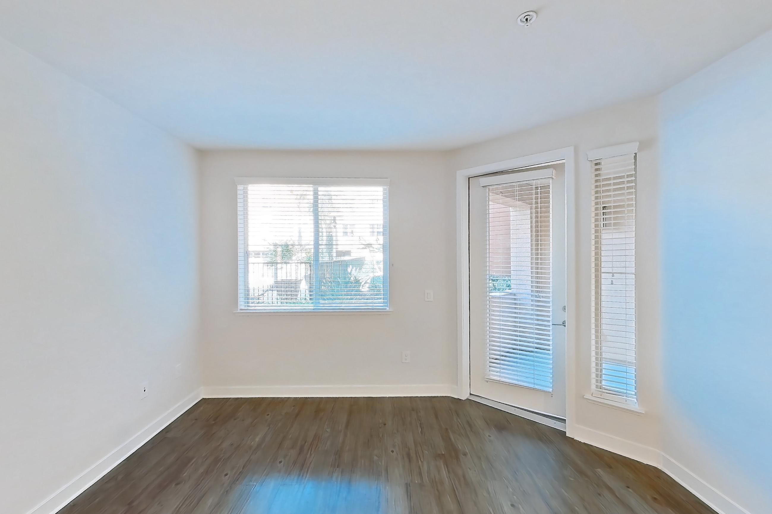 Living room with dark wood-finish flooring, Apartment 1141 at The Verge Apartments